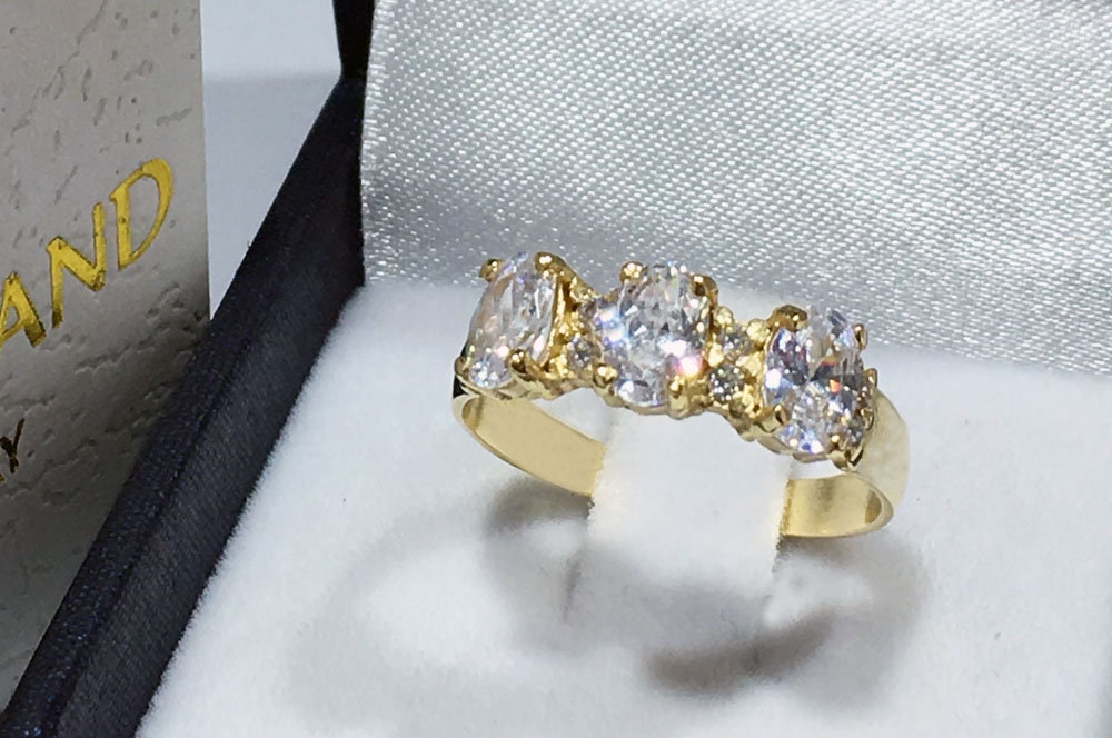 April Birthstone Oval Clear Quartz Three Stone Ring with Small Quartz Accents - H.L.Jewelry