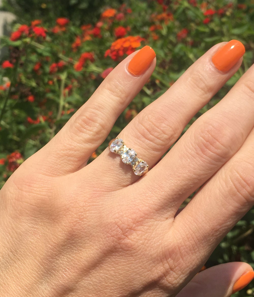 April Birthstone Oval Clear Quartz Three Stone Ring with Small Quartz Accents - H.L.Jewelry