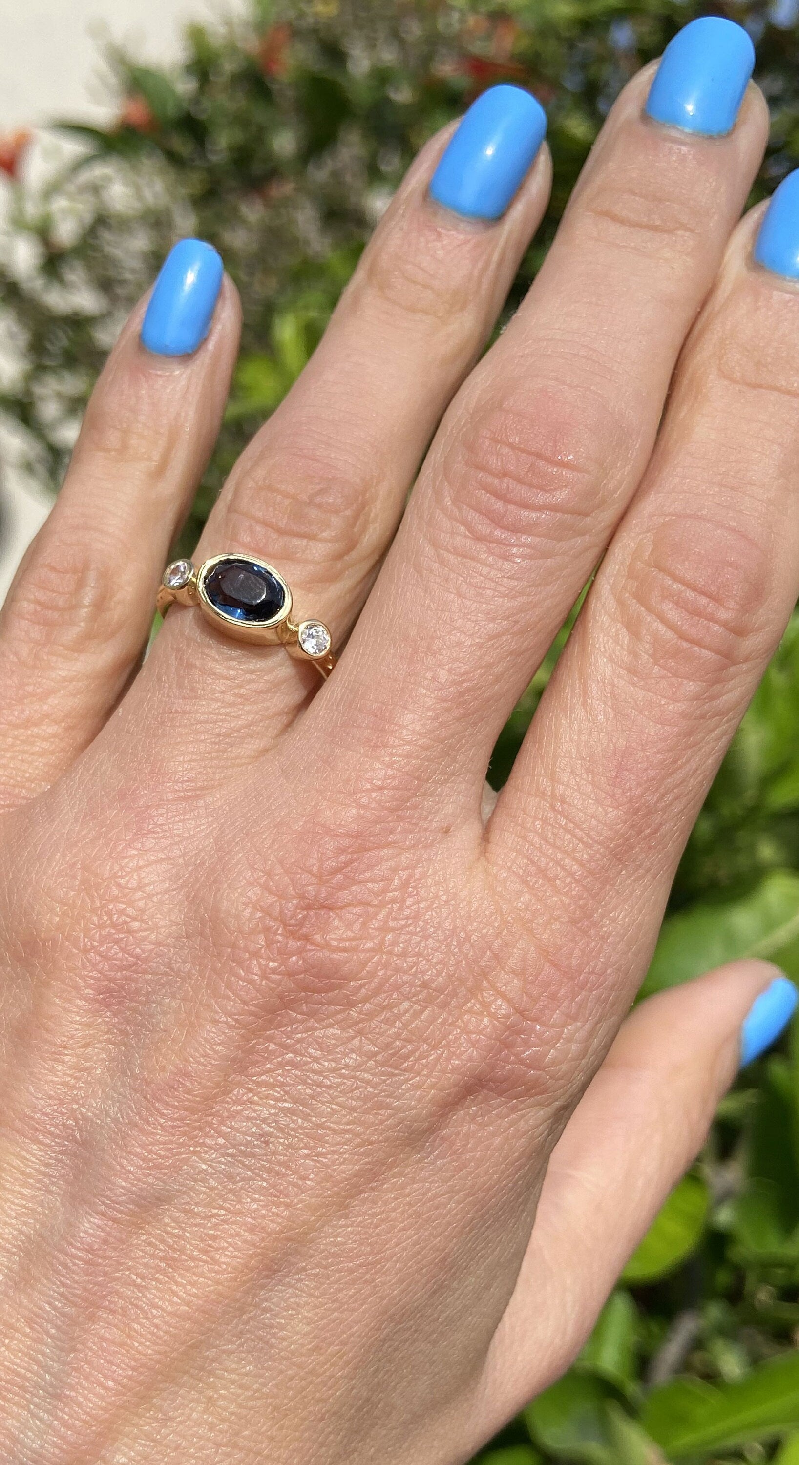 East-West Oval Blue Sapphire Bezel Ring with Clear Quartz Accents - H.L.Jewelry