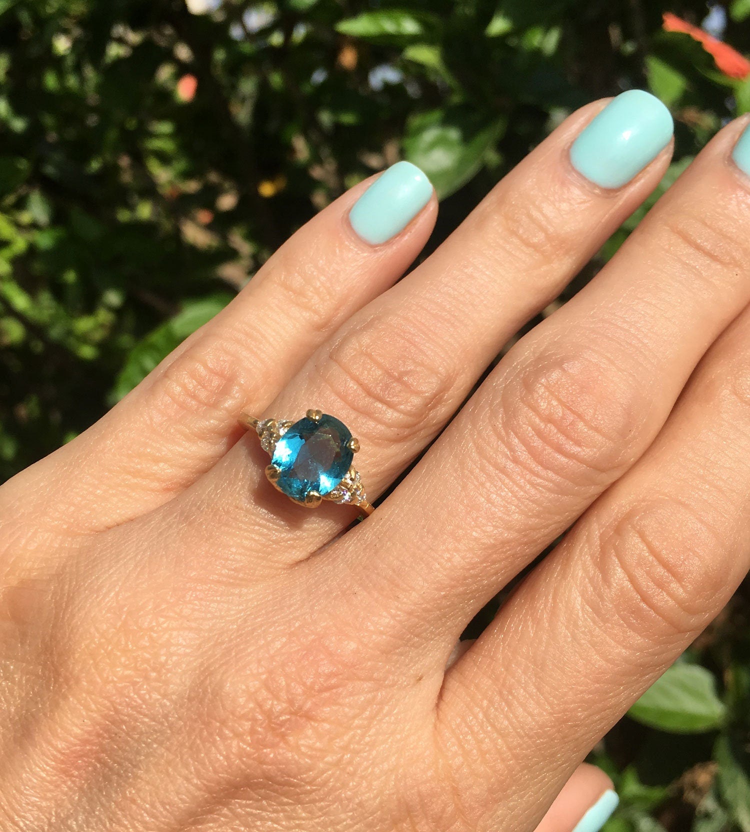 Oval Blue Topaz Engagement Ring with Clear Quartz Accents - H.L.Jewelry