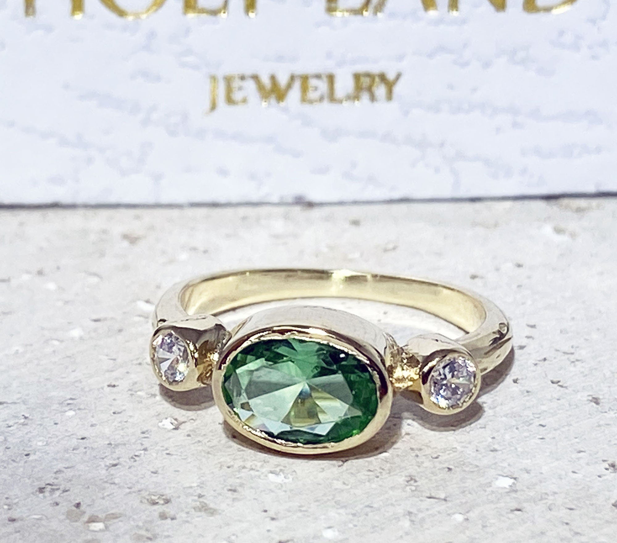 Oval Green Sapphire Bezel Ring with Clear Quartz Accents - H.L.Jewelry