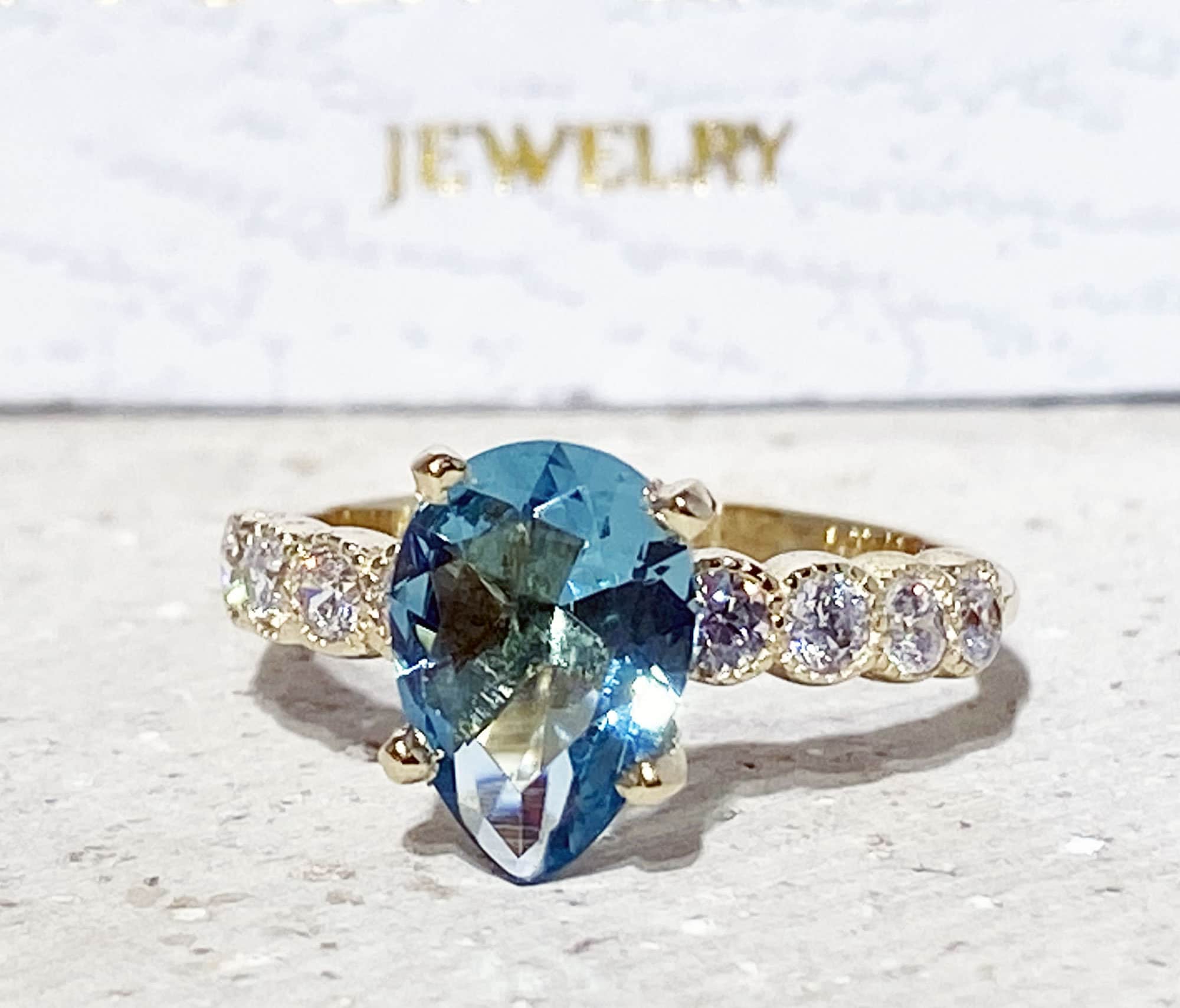 Pear-Shaped Blue Topaz Engagement Ring with Clear Quartz Accents - H.L.Jewelry