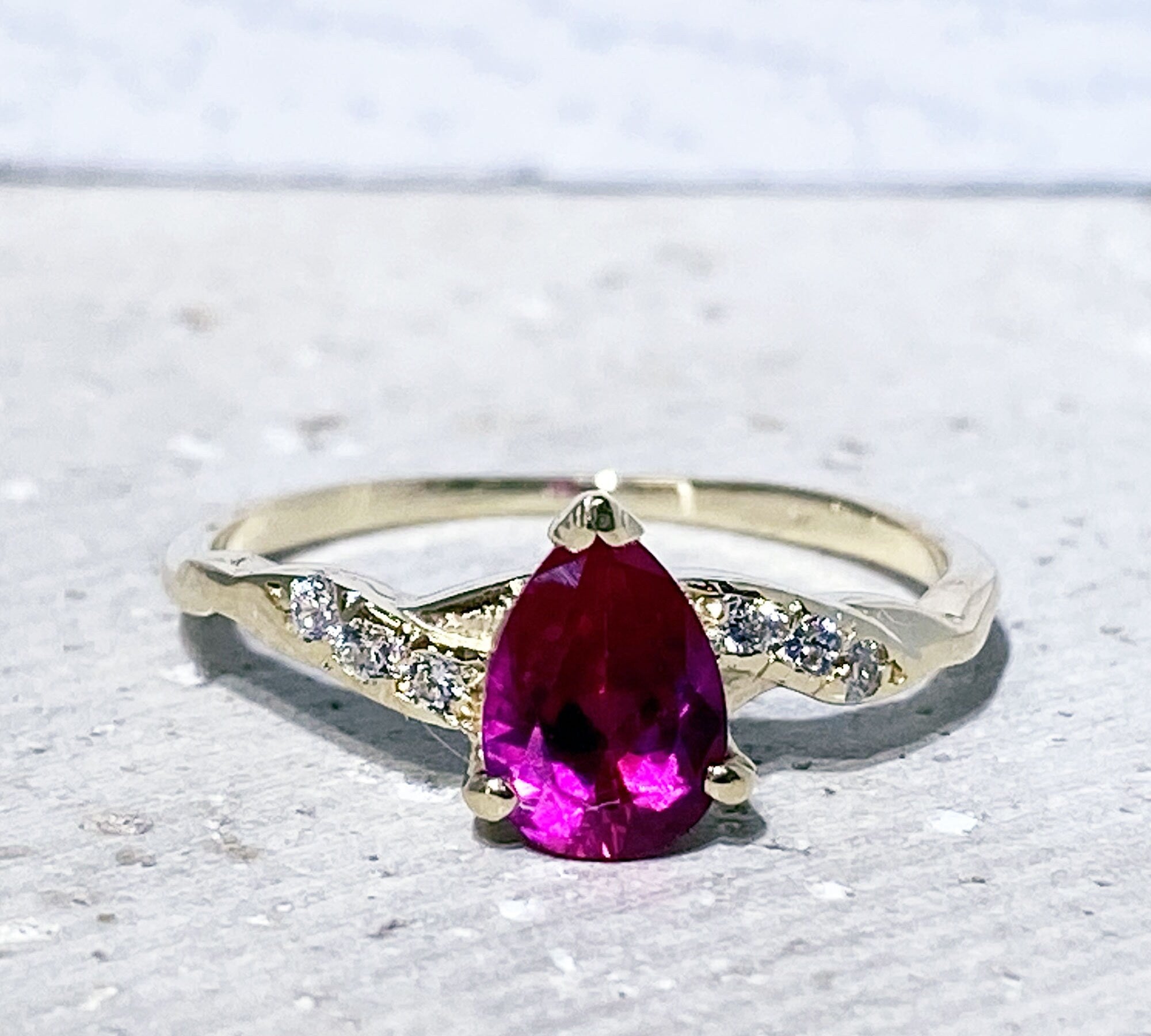 Pear-Shaped Ruby Delicate Ring with Clear Quartz Accents - H.L.Jewelry