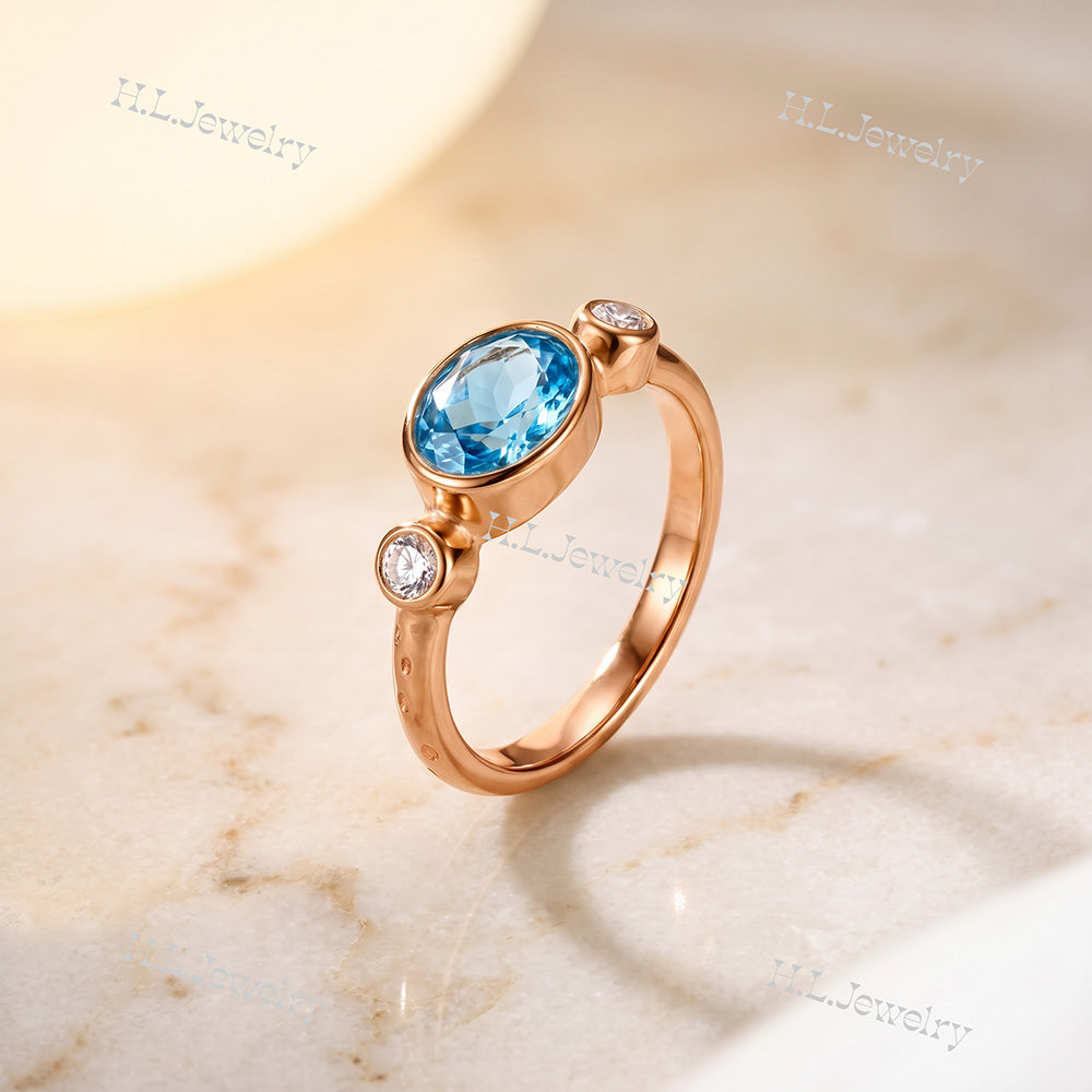 Oval Blue Topaz Bezel-Set Ring with Clear Quartz Accents - H.L.Jewelry