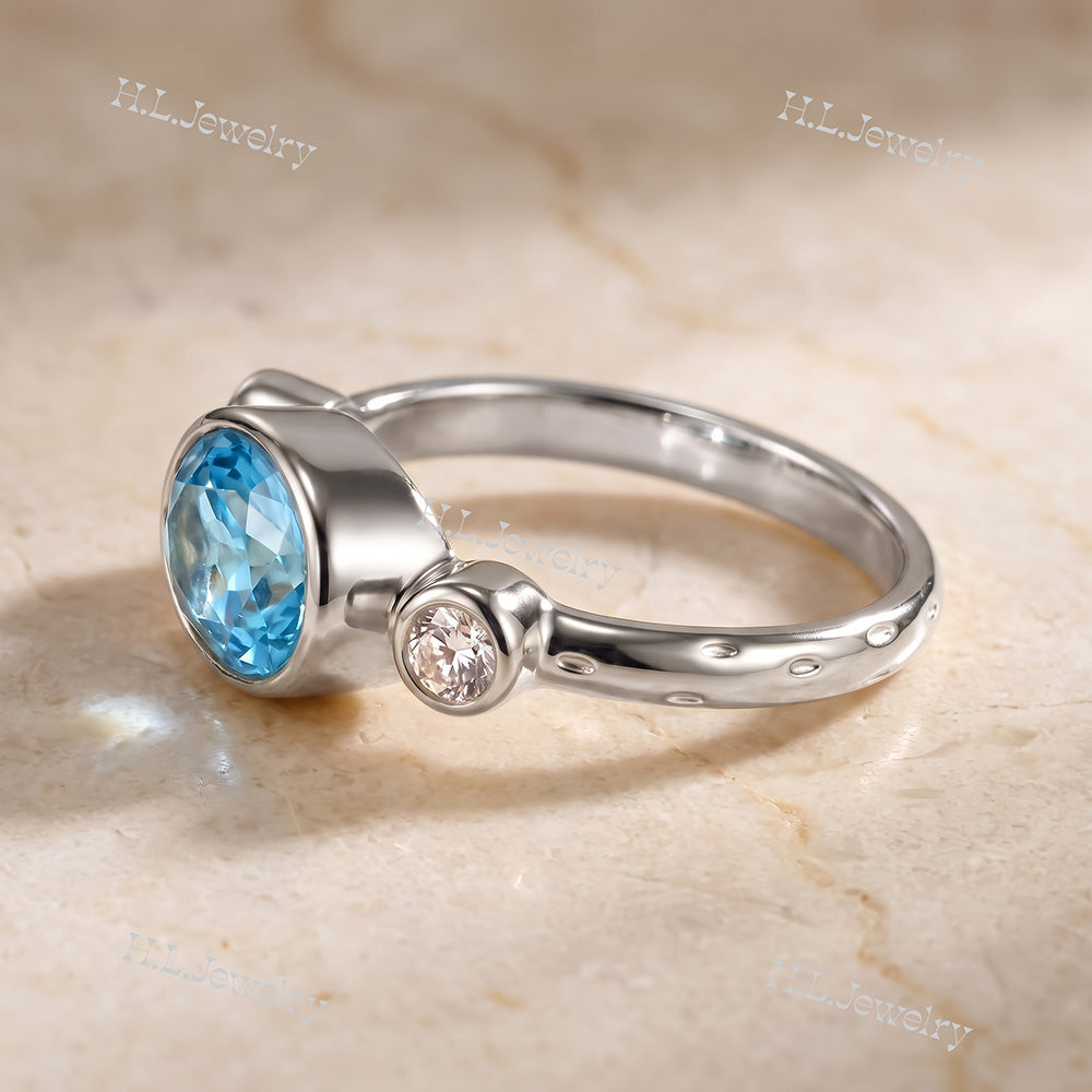 Oval Blue Topaz Bezel-Set Ring with Clear Quartz Accents - H.L.Jewelry