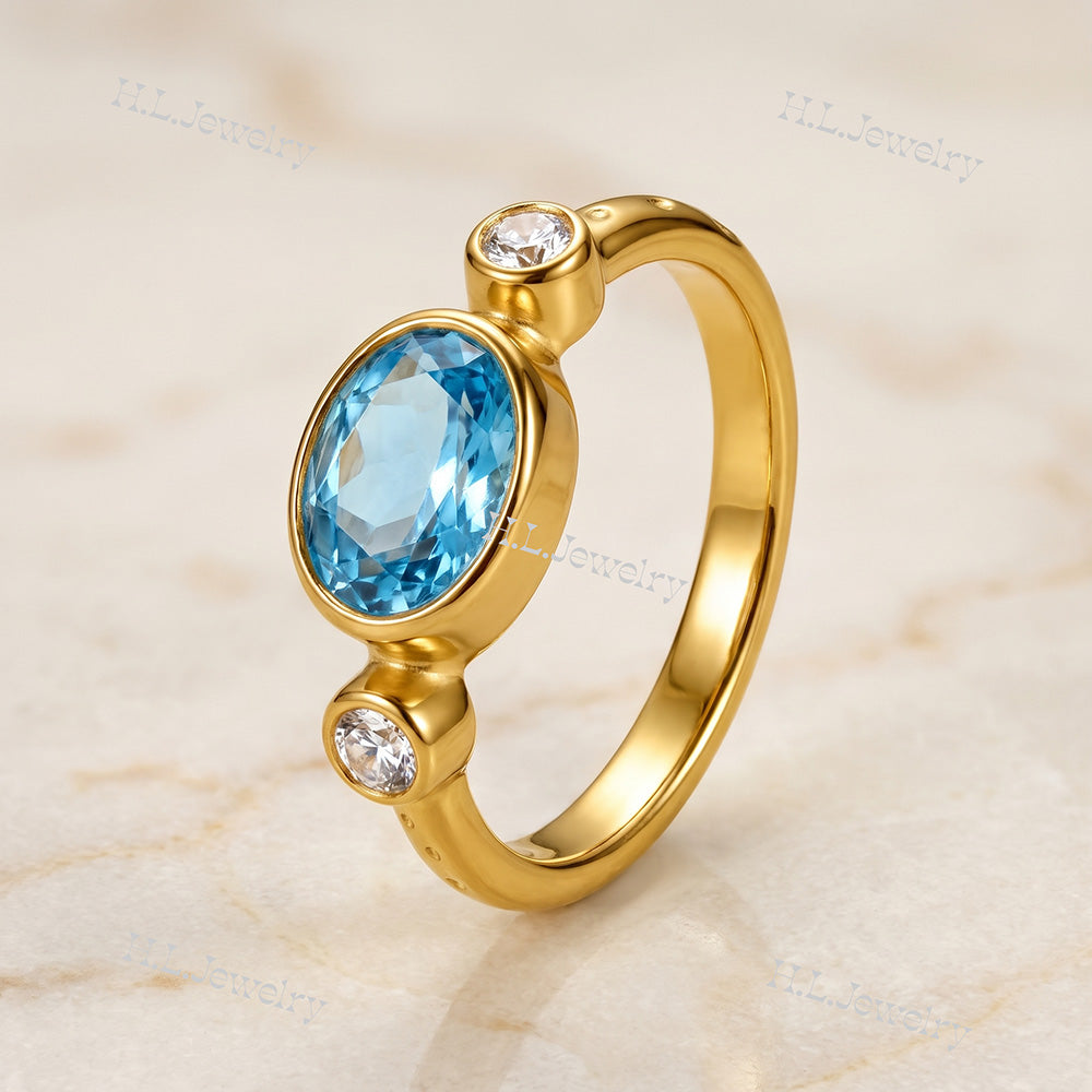 Oval Blue Topaz Bezel-Set Ring with Clear Quartz Accents - H.L.Jewelry