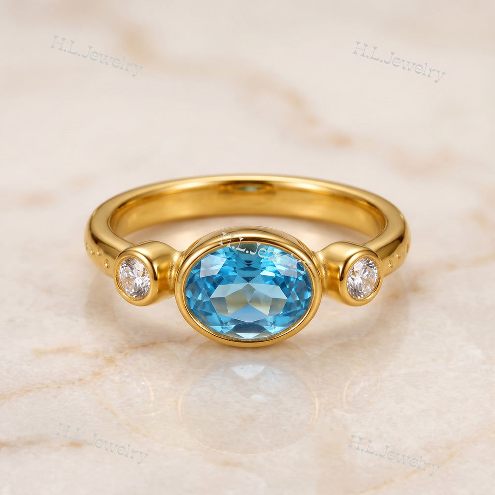 Oval Blue Topaz Bezel-Set Ring with Clear Quartz Accents - H.L.Jewelry
