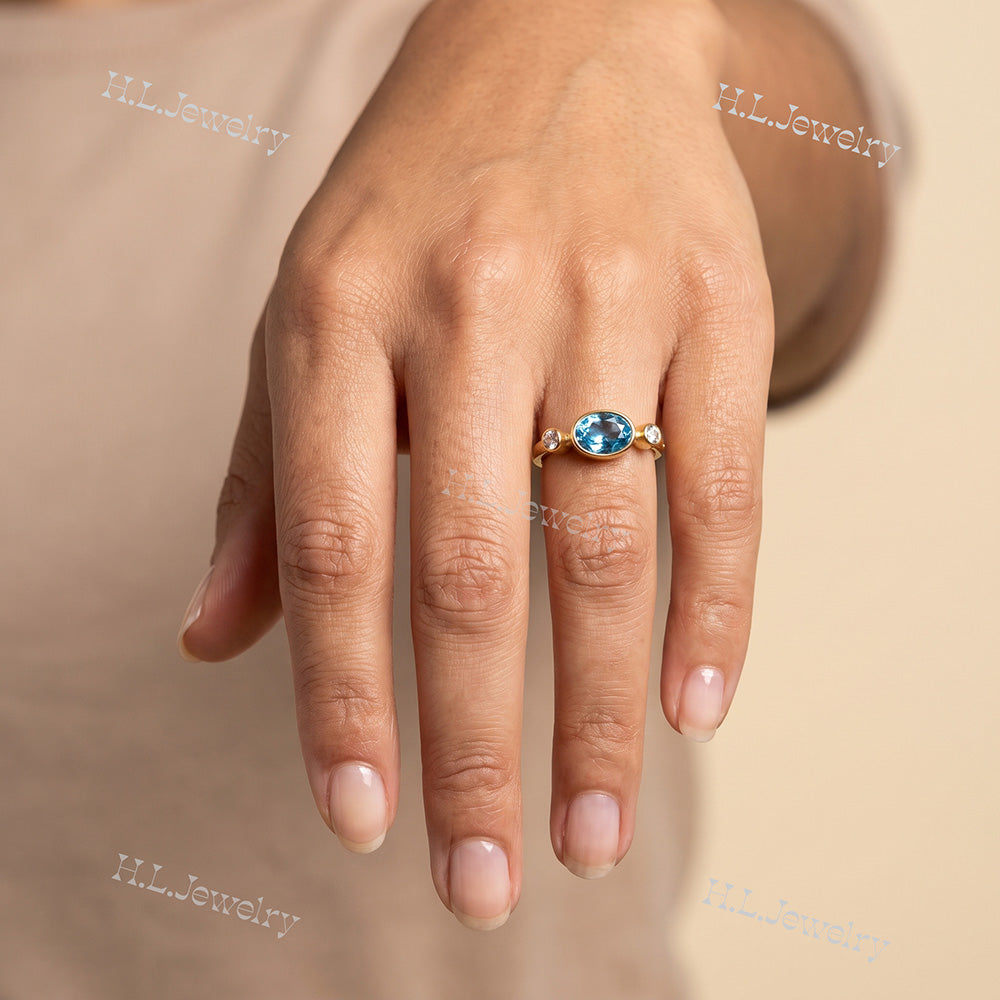 Oval Blue Topaz Bezel-Set Ring with Clear Quartz Accents - H.L.Jewelry