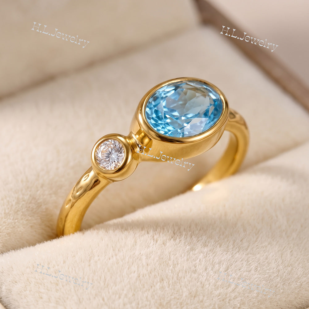 Oval Blue Topaz Bezel-Set Ring with Clear Quartz Accents - H.L.Jewelry