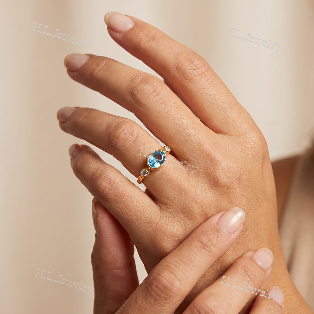 Oval Blue Topaz Bezel-Set Ring with Clear Quartz Accents - H.L.Jewelry