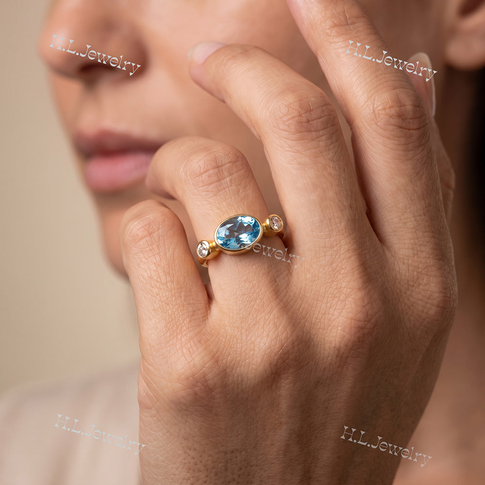 Oval Blue Topaz Bezel-Set Ring with Clear Quartz Accents - H.L.Jewelry