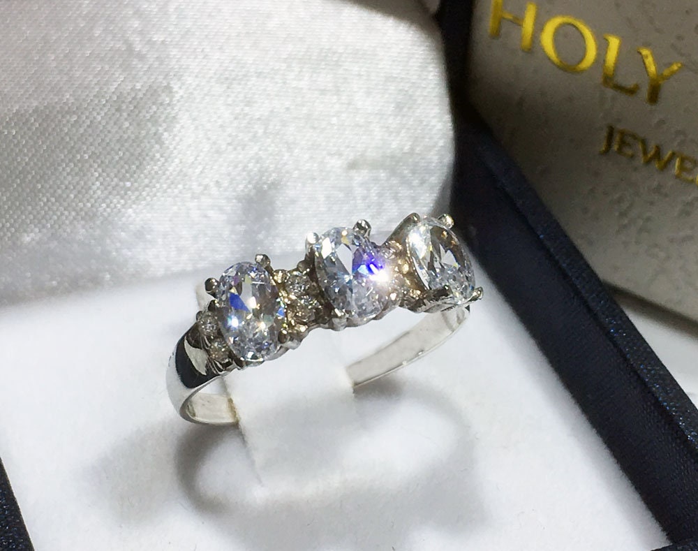 April Birthstone Oval Clear Quartz Three Stone Ring with Small Quartz Accents - H.L.Jewelry
