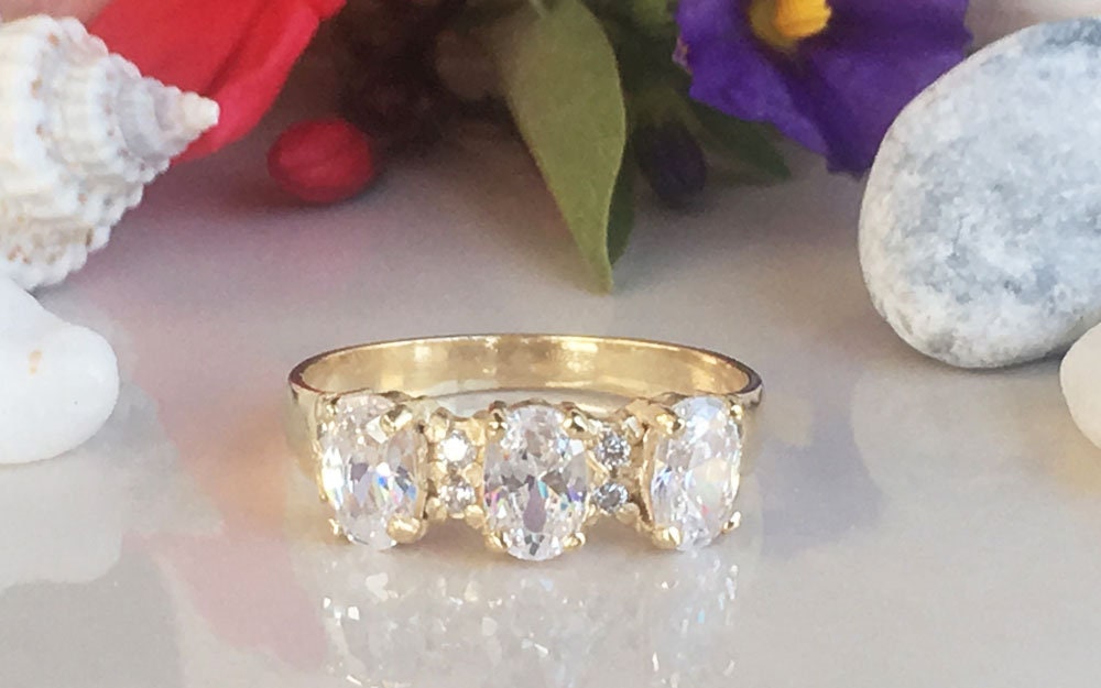 April Birthstone Oval Clear Quartz Three Stone Ring with Small Quartz Accents - H.L.Jewelry