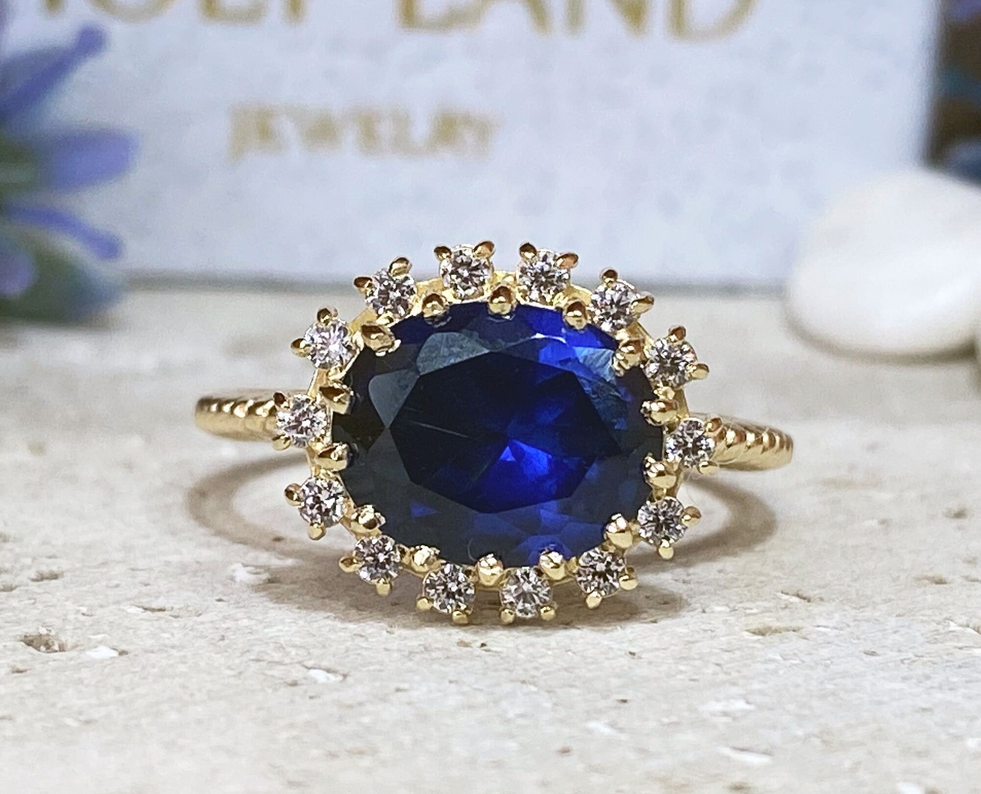 East-West Oval Blue Sapphire Ring with Clear Quartz Halo - H.L.Jewelry