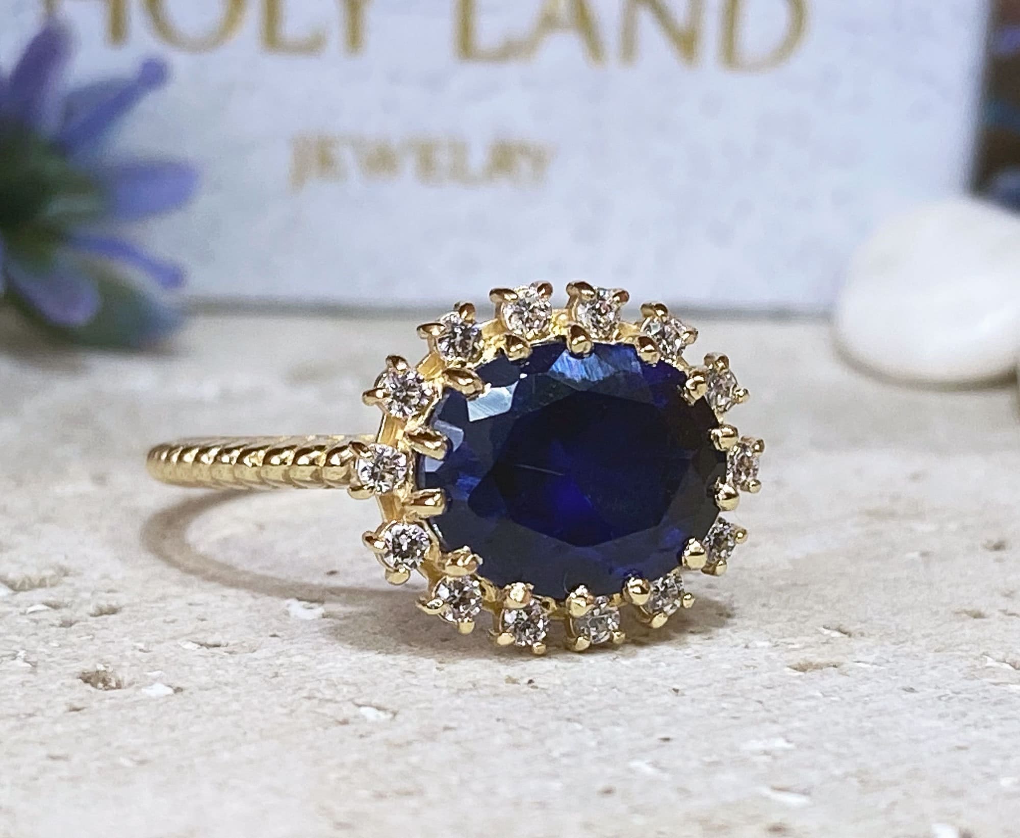 East-West Oval Blue Sapphire Ring with Clear Quartz Halo - H.L.Jewelry