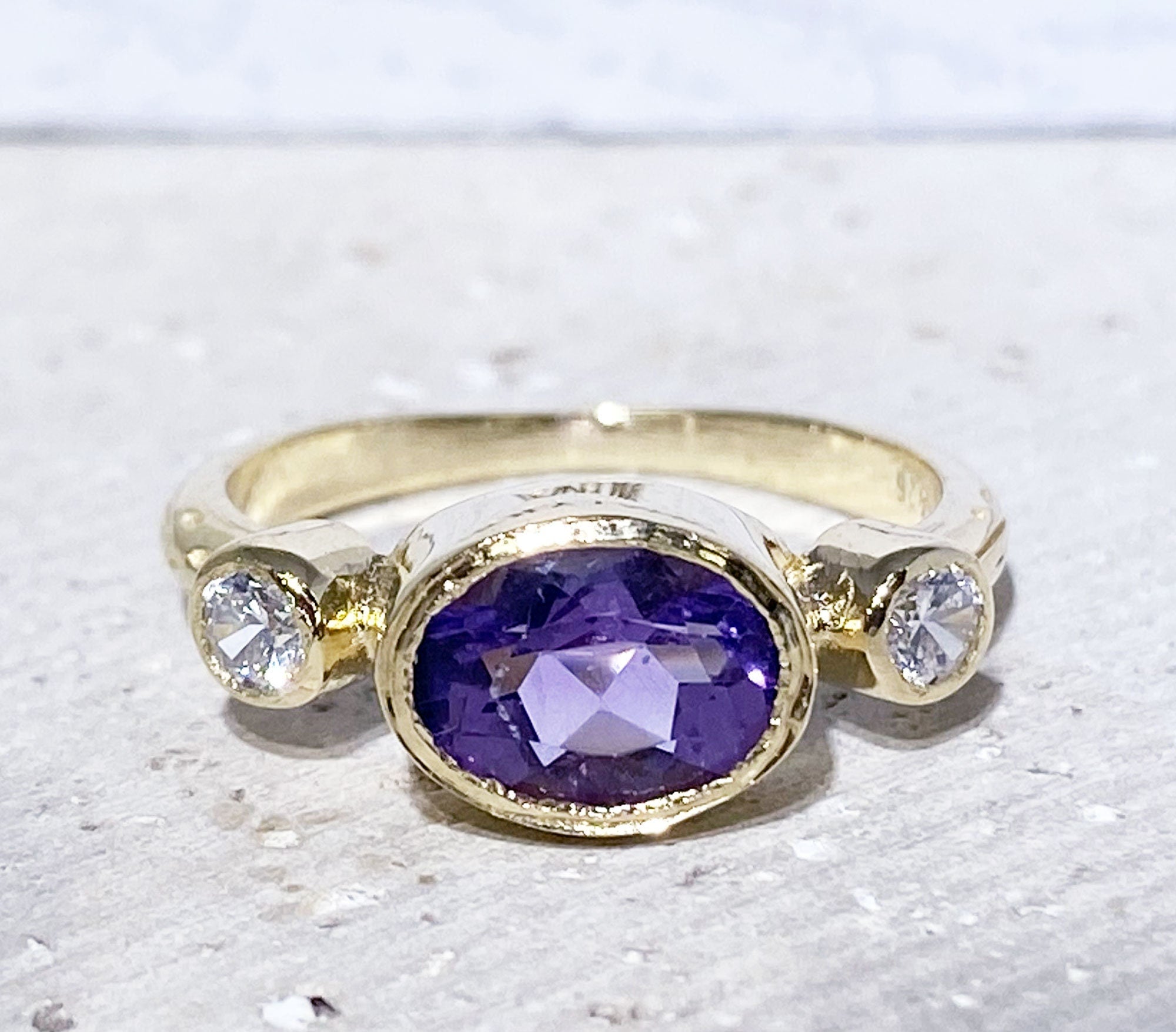 Oval Amethyst Three Stone Bezel Ring with Clear Quartz Accents - H.L.Jewelry