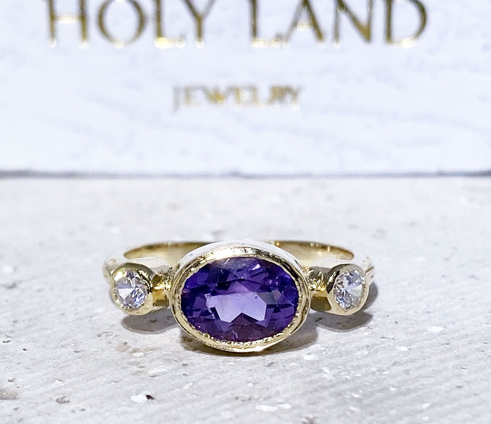 Oval Amethyst Three Stone Bezel Ring with Clear Quartz Accents - H.L.Jewelry
