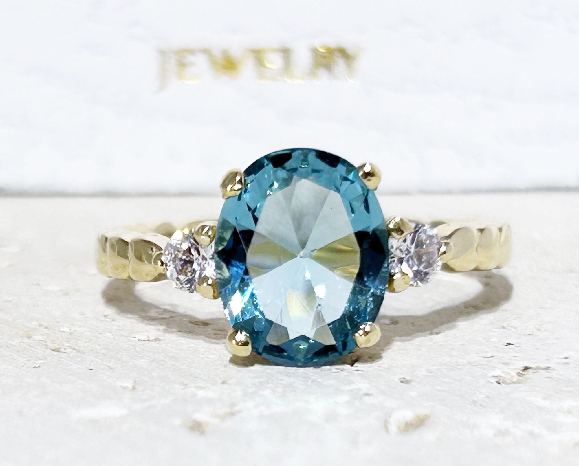 Oval Blue Topaz Gemstone Ring with Clear Quartz Accents - H.L.Jewelry