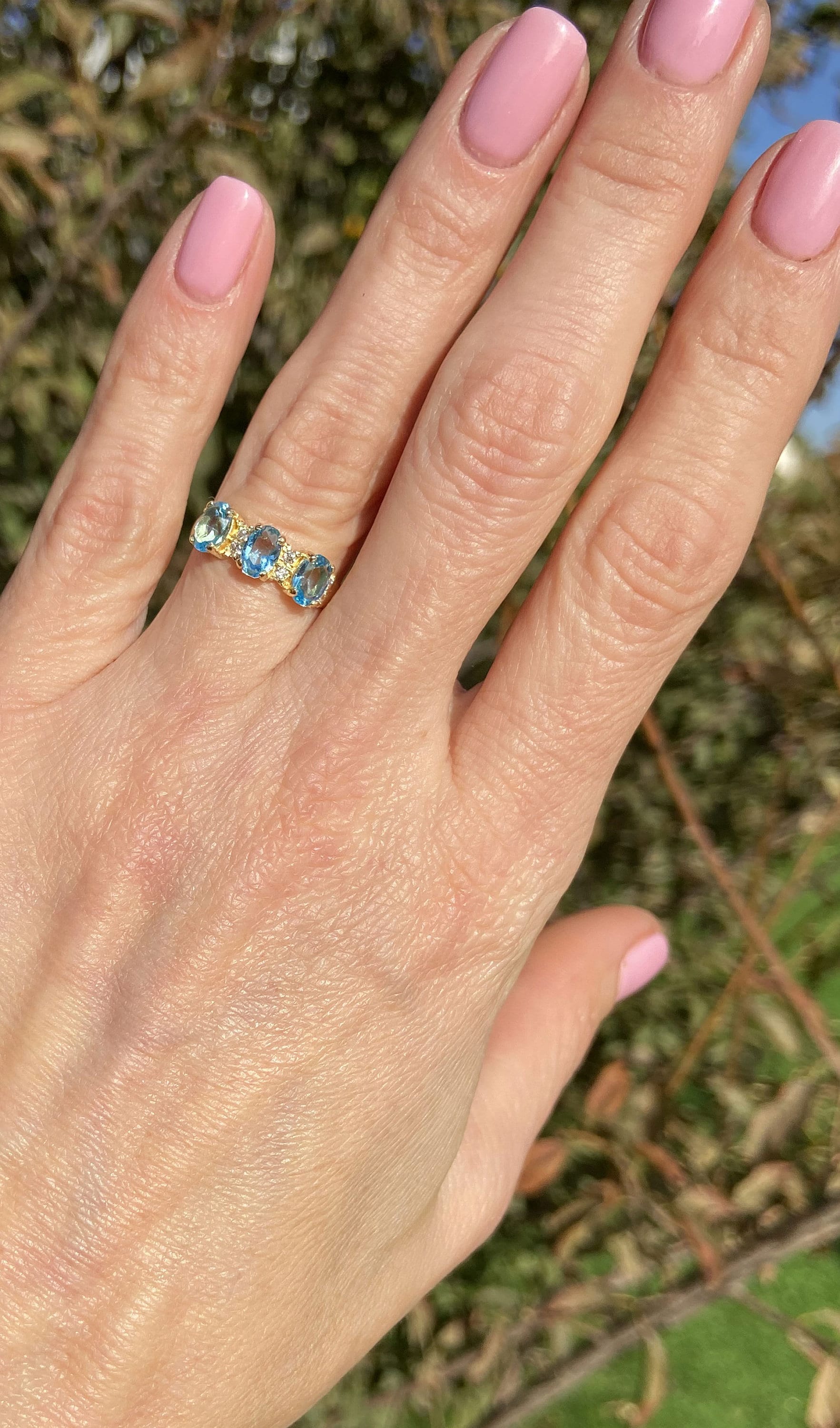 Oval Blue Topaz Three Stone Ring with Clear Quartz Accents - H.L.Jewelry