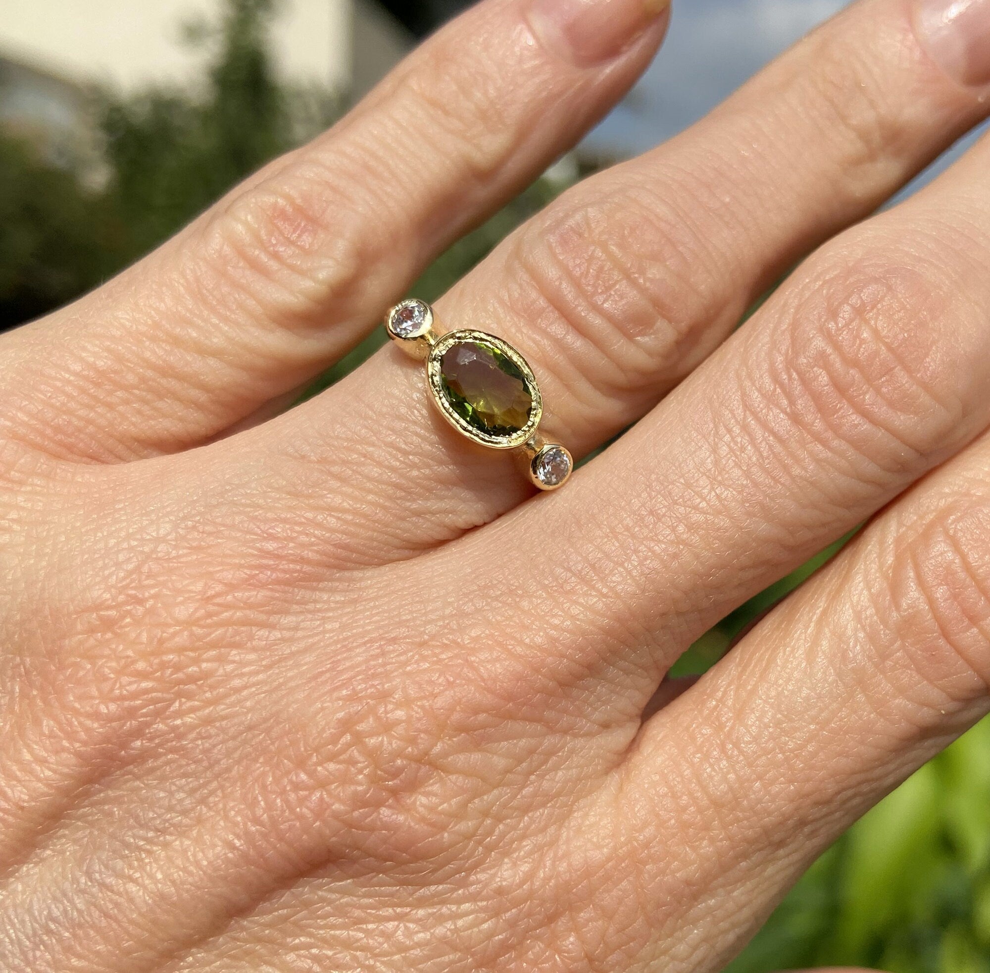 Oval Peridot Three Stone Bezel Ring with Clear Quartz Accents - H.L.Jewelry