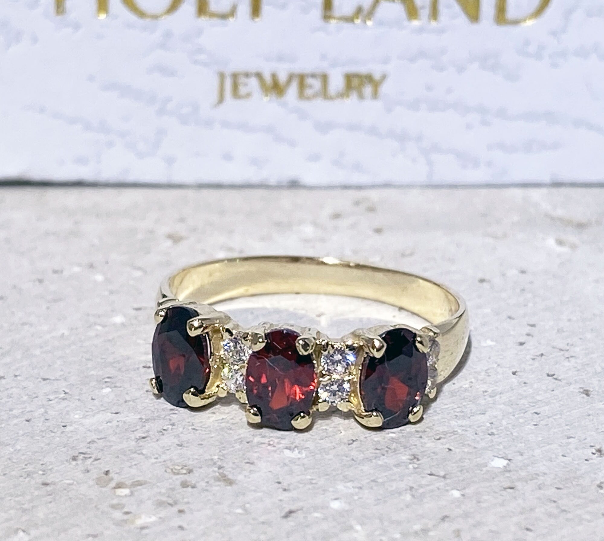 Oval Red Garnet Three-Stone Ring with Clear Quartz Accents - H.L.Jewelry