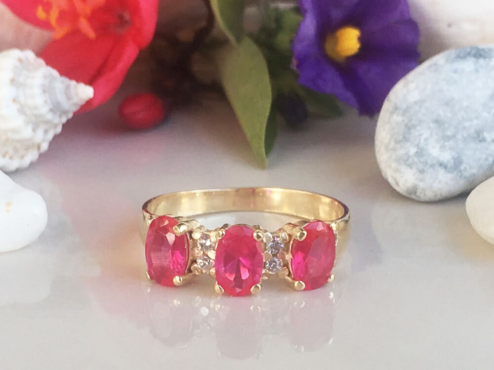 Oval Ruby Three-Stone Ring with Clear Quartz Accents - H.L.Jewelry