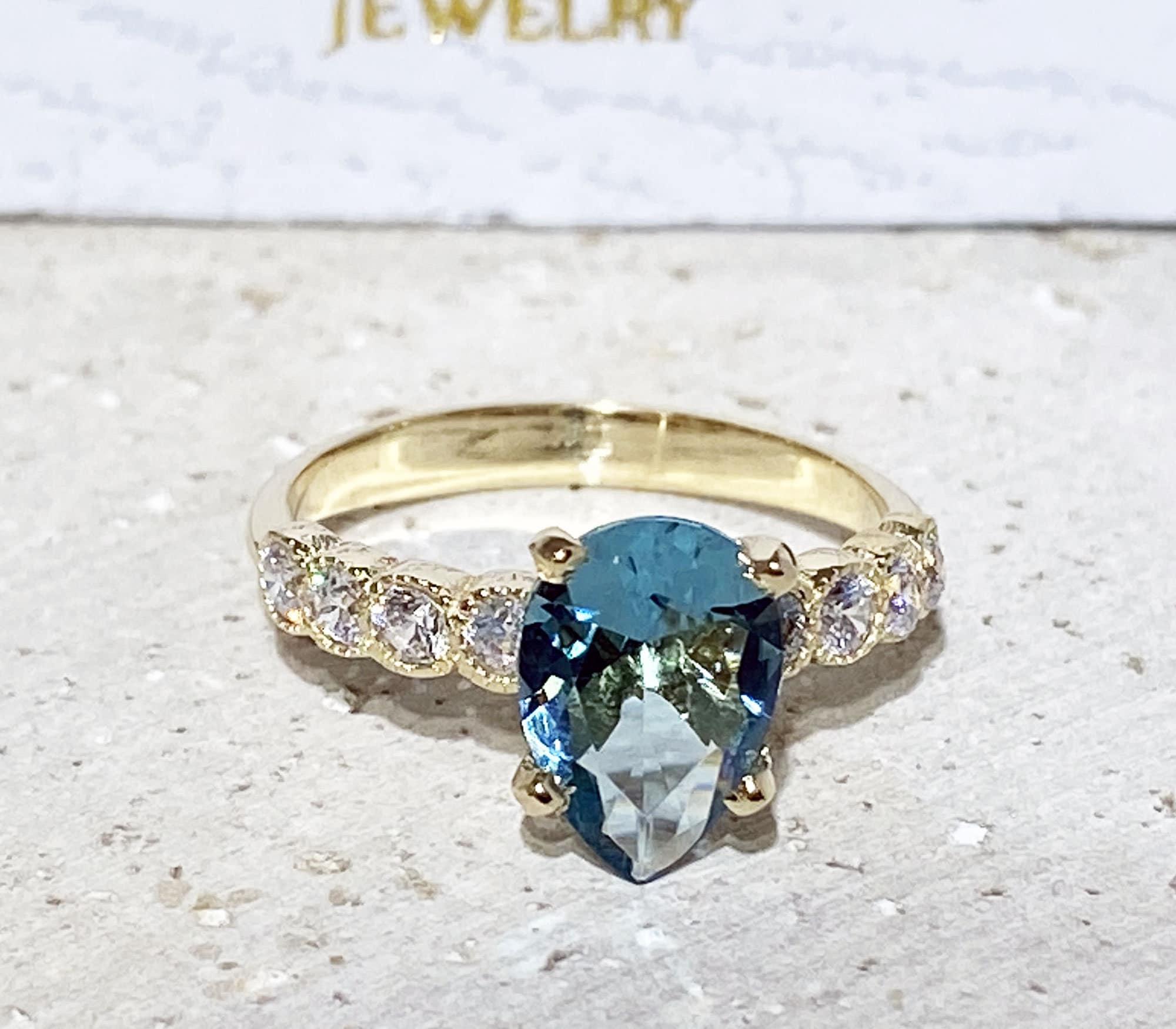 Pear-Shaped Blue Topaz Engagement Ring with Clear Quartz Accents - H.L.Jewelry