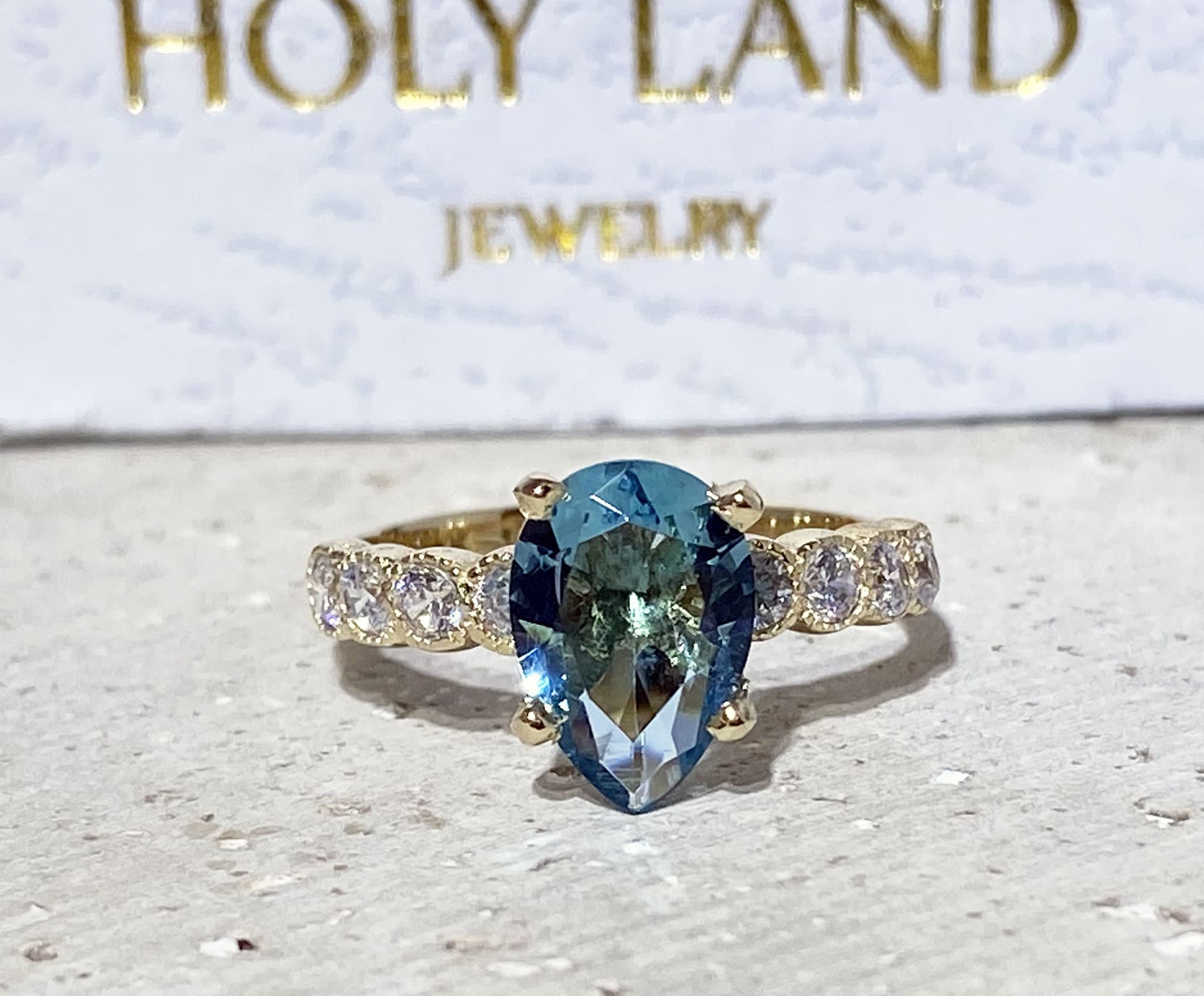 Pear-Shaped Blue Topaz Engagement Ring with Clear Quartz Accents - H.L.Jewelry