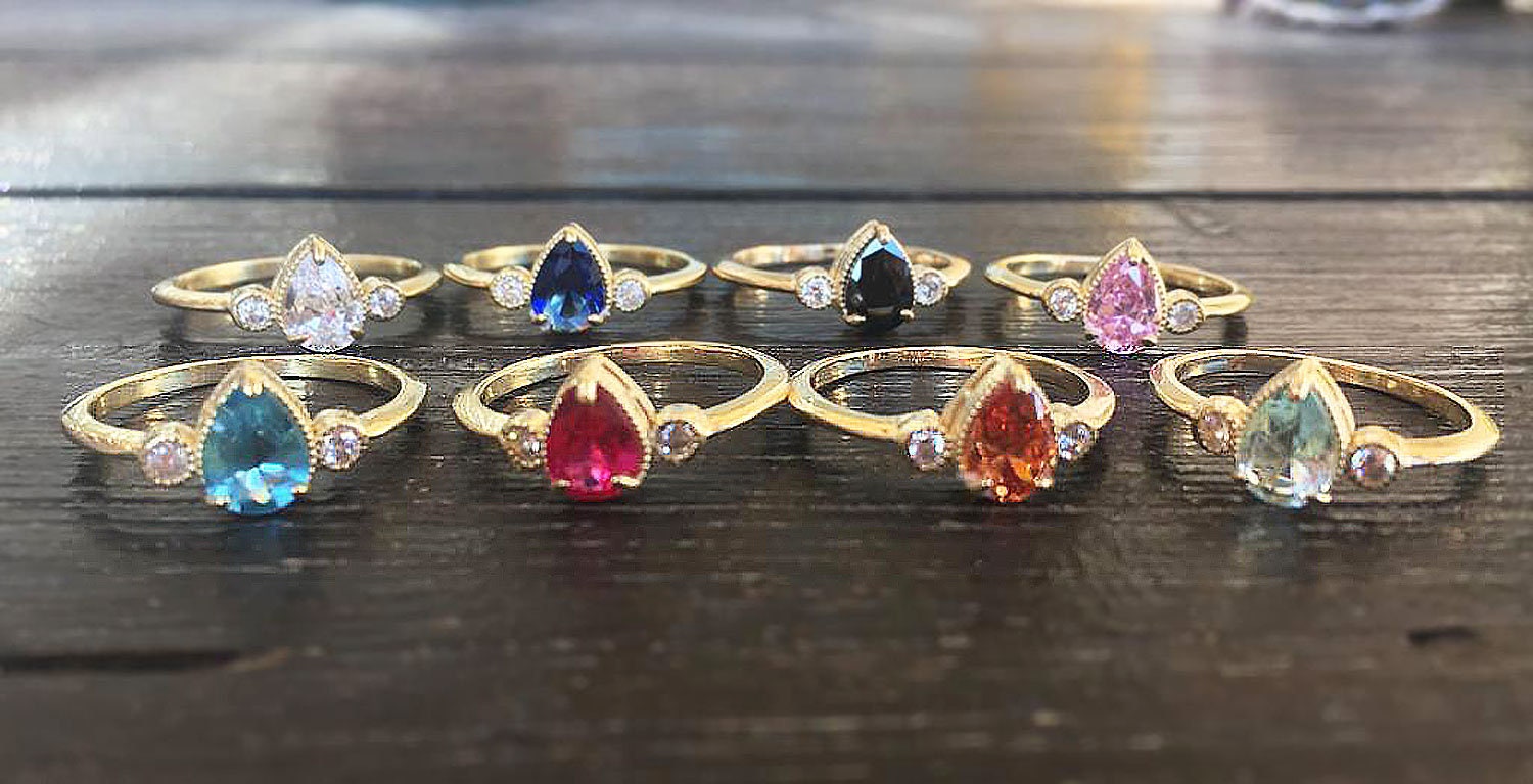 Pear-Shaped Ruby Bezel Ring with Clear Quartz Accents - H.L.Jewelry