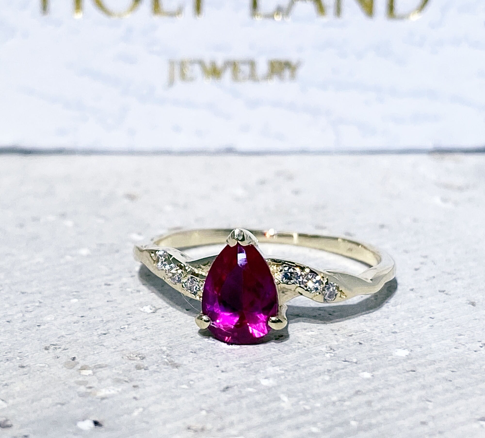 Pear-Shaped Ruby Delicate Ring with Clear Quartz Accents - H.L.Jewelry