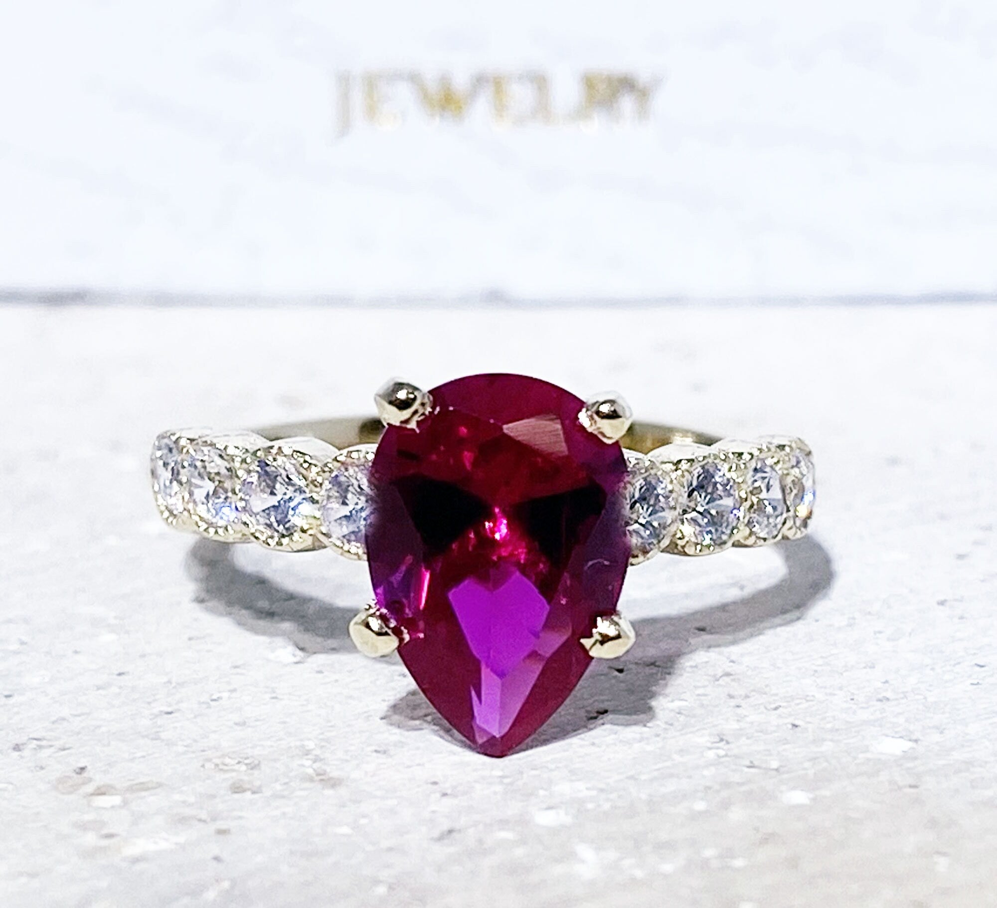 Pear-Shaped Ruby Engagement Ring with Clear Quartz Accents - H.L.Jewelry