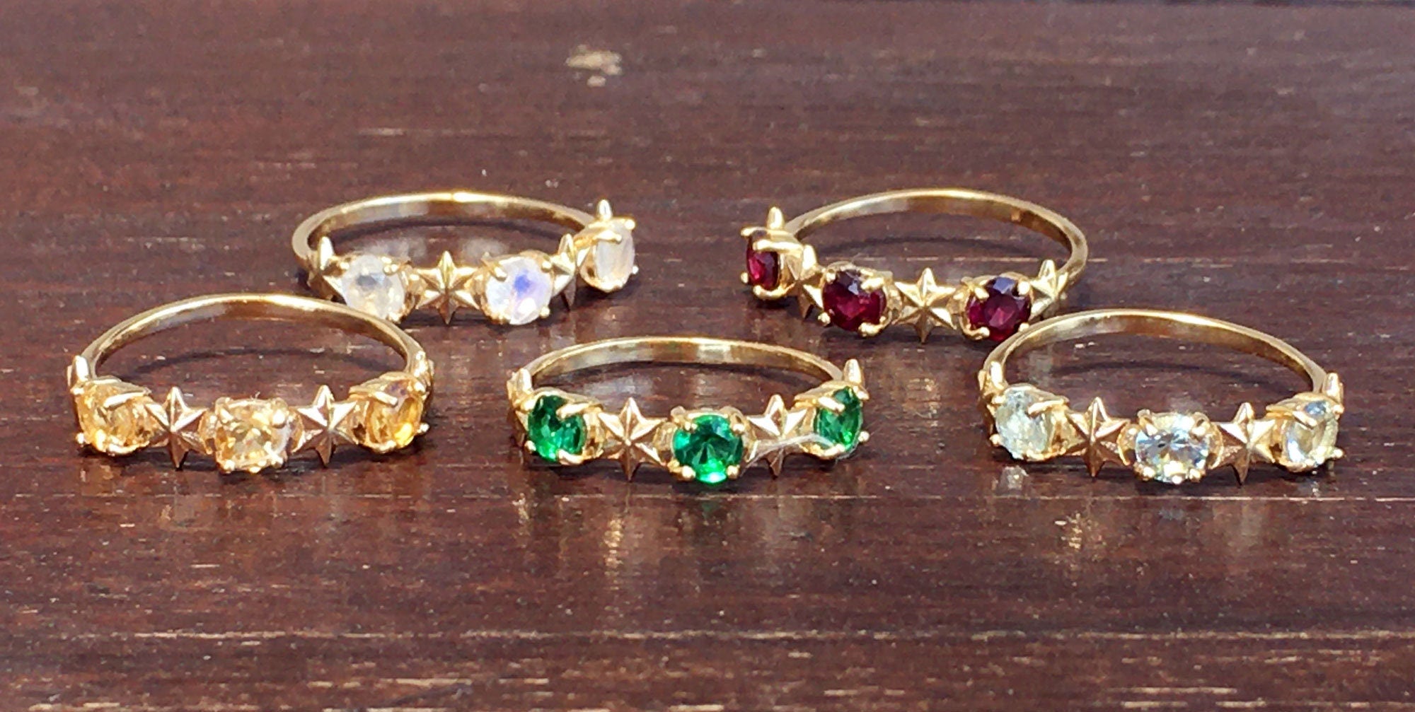 Round Emerald Three Stone Ring with Star Accents - H.L.Jewelry