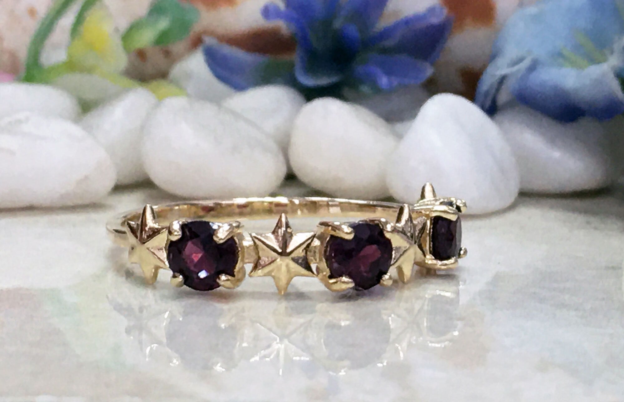 Round Red Garnet Three Stone Ring with Star Accents - H.L.Jewelry
