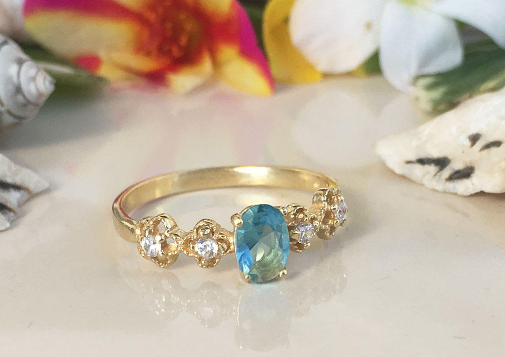 Blue Topaz Ring - December Birthstone - Delicate Ring with Oval Blue Topaz Gemstone and Flower Setting with Clear Quartz Accents - H.L.Jewelry