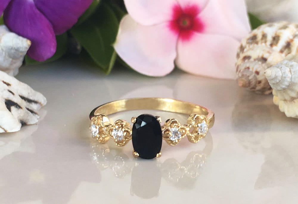 Black Onyx Ring - December Birthstone - Delicate Ring with Oval Black Onyx Middle Gemstone and Flower Setting with Clear Quartz Accents - H.L.Jewelry