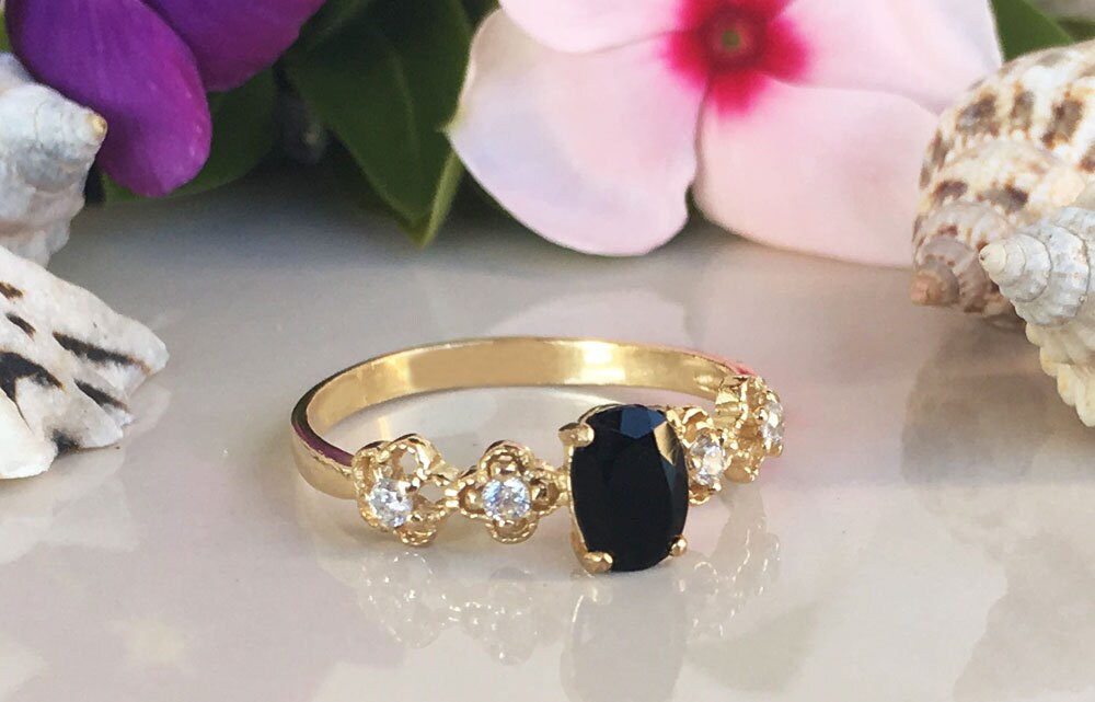 Black Onyx Ring - December Birthstone - Delicate Ring with Oval Black Onyx Middle Gemstone and Flower Setting with Clear Quartz Accents - H.L.Jewelry