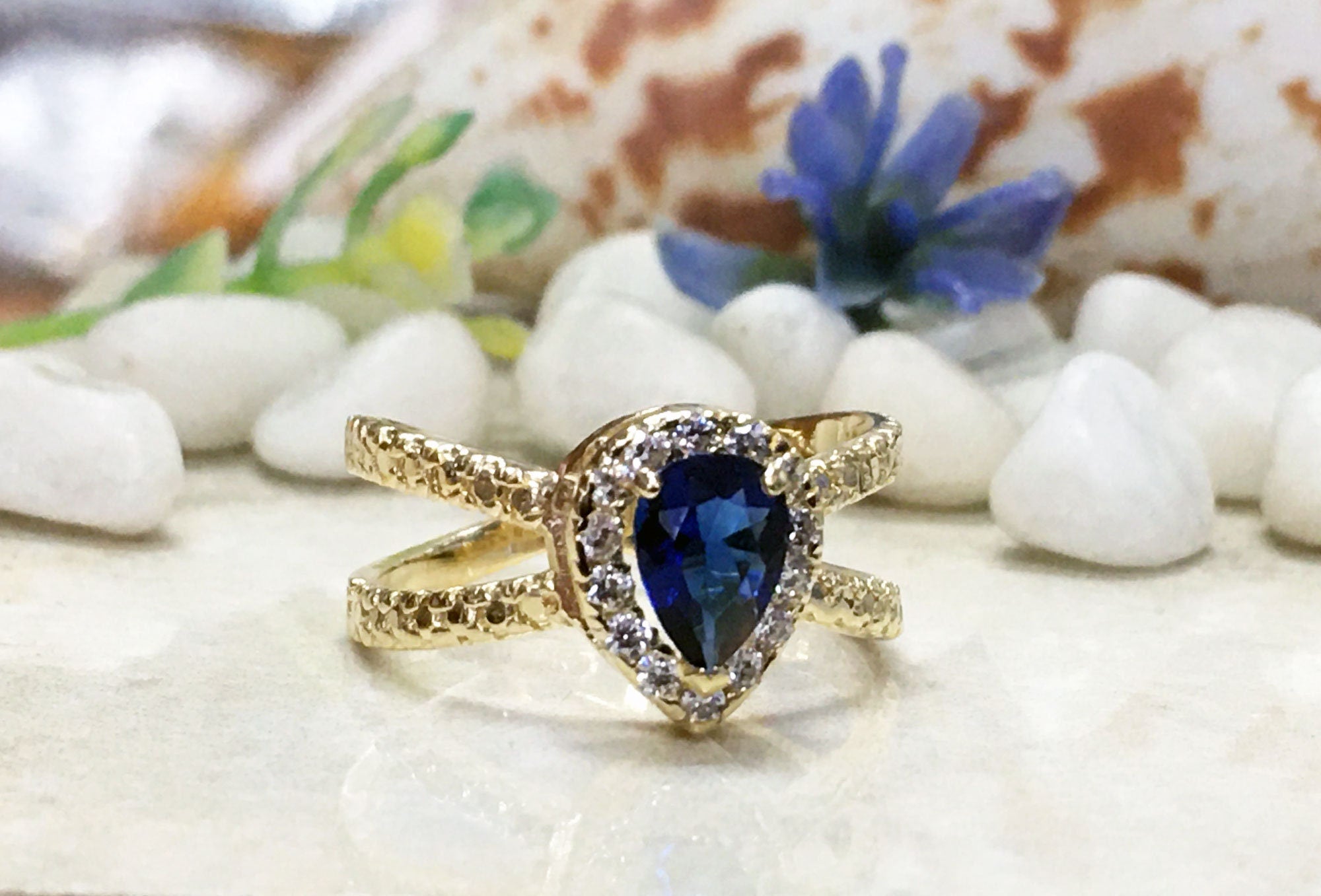 Blue Sapphire Ring - September Birthstone - Engagement Ring with Pear Shape Blue Sapphire Center Stone and Clear Quartz Halo - H.L.Jewelry