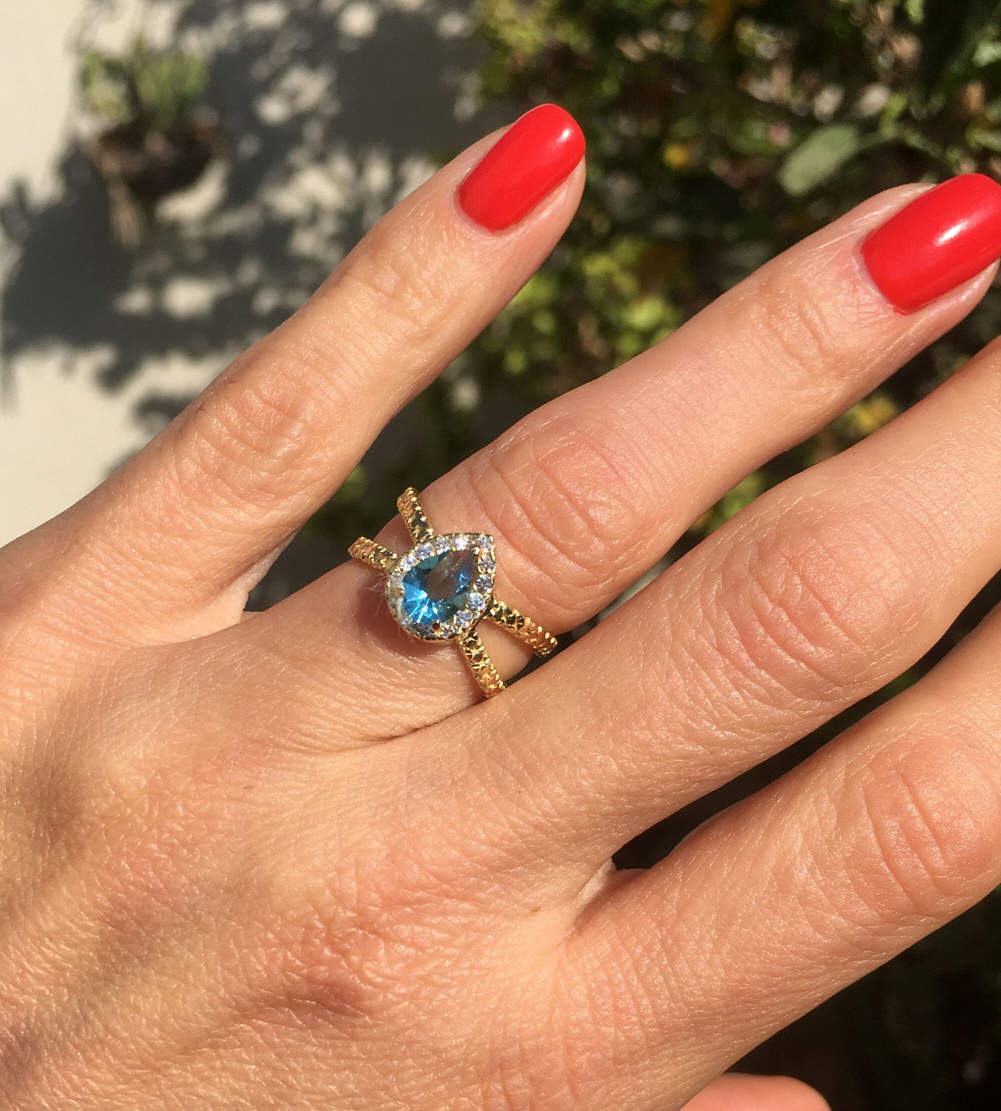 Blue Topaz Ring - December Birthstone - Statement Engagement Ring with Pear-Shaped Blue Topaz Gemstone and Clear Quartz Halo - H.L.Jewelry