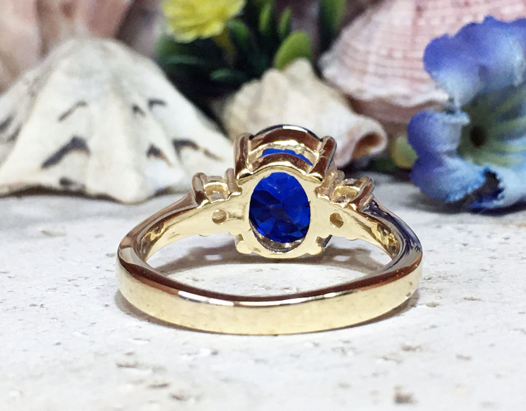 Blue Sapphire Ring - September Birthstone - Statement Engagement Ring with Oval Blue Sapphire Gemstone and Clear Quartz Accents - H.L.Jewelry