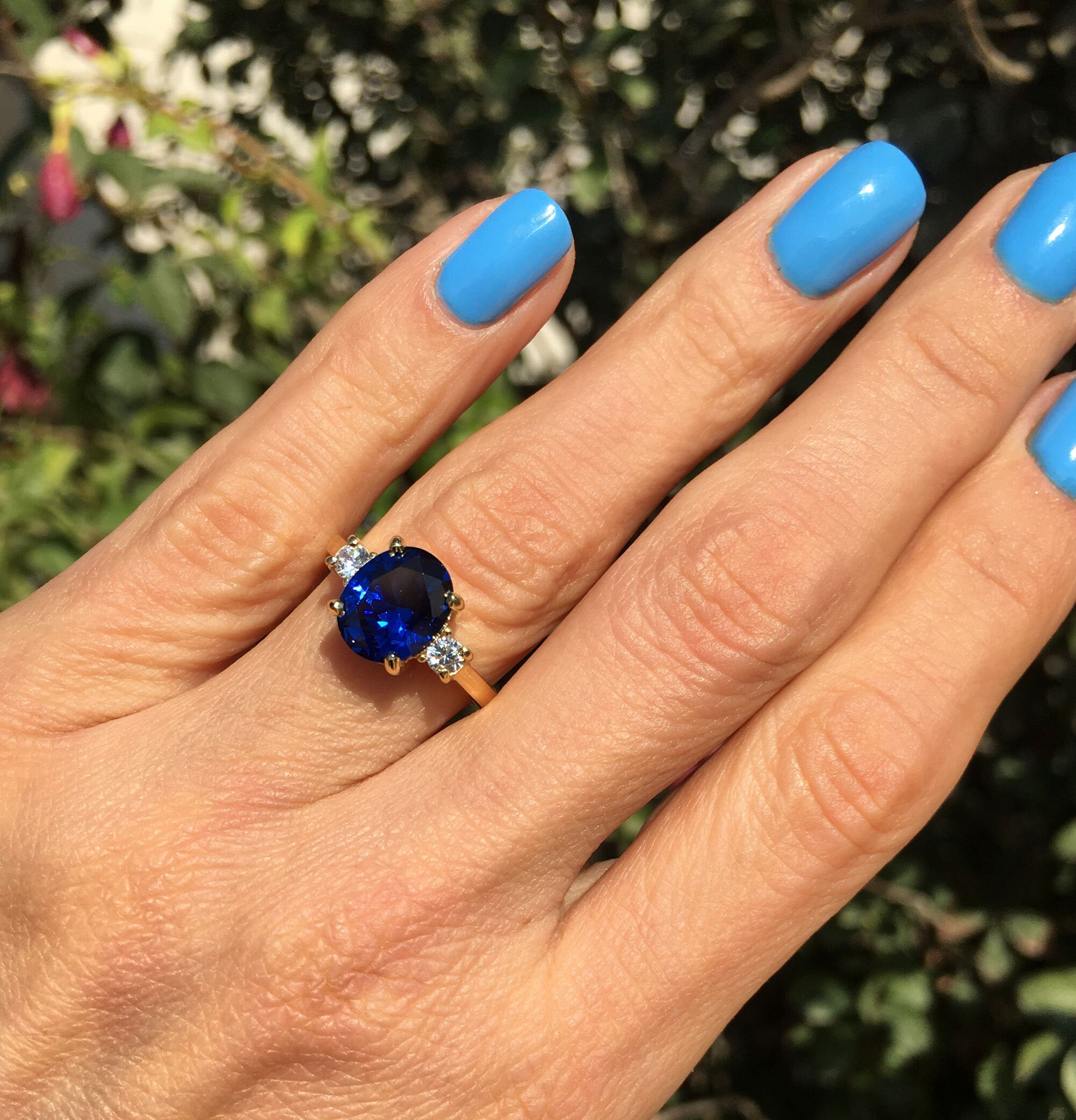 Blue Sapphire Ring - September Birthstone - Statement Engagement Ring with Oval Blue Sapphire Gemstone and Clear Quartz Accents - H.L.Jewelry