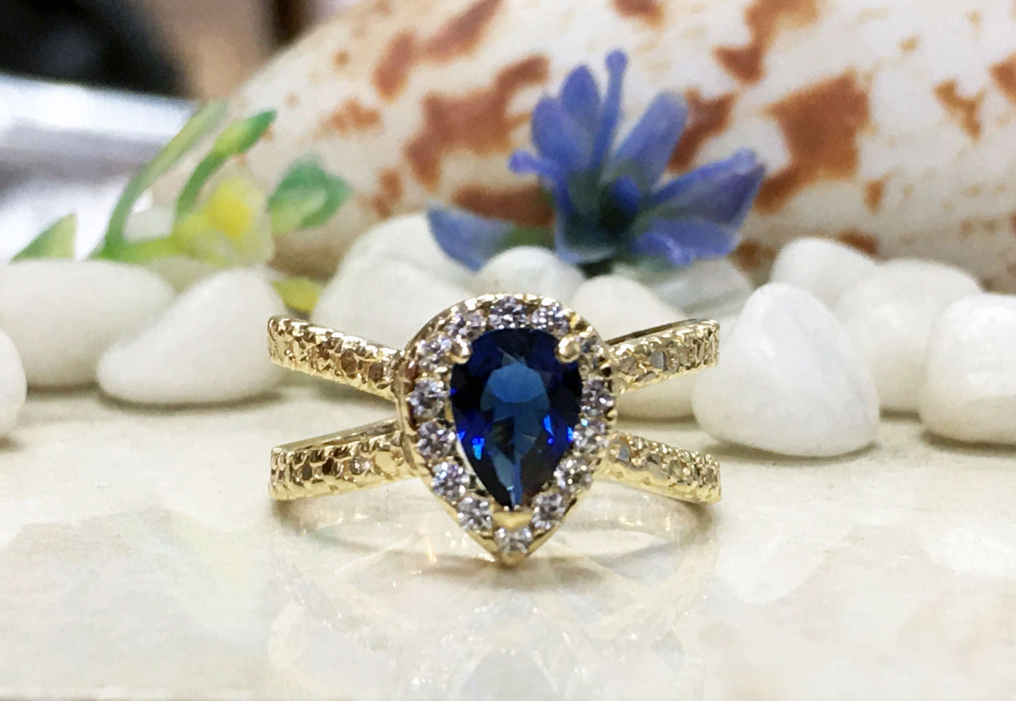 Blue Sapphire Ring - September Birthstone - Engagement Ring with Pear Shape Blue Sapphire Center Stone and Clear Quartz Halo - H.L.Jewelry