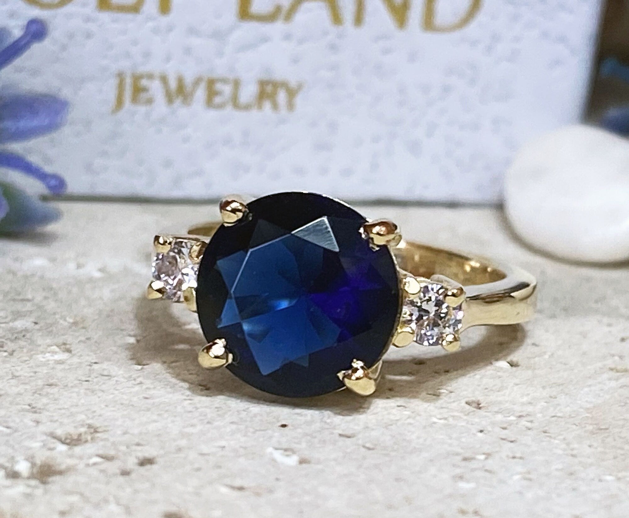 Blue Sapphire Ring - September Birthstone - Statement Engagement Ring with Round Blue Sapphire Gemstone and Clear Quartz Accents - H.L.Jewelry