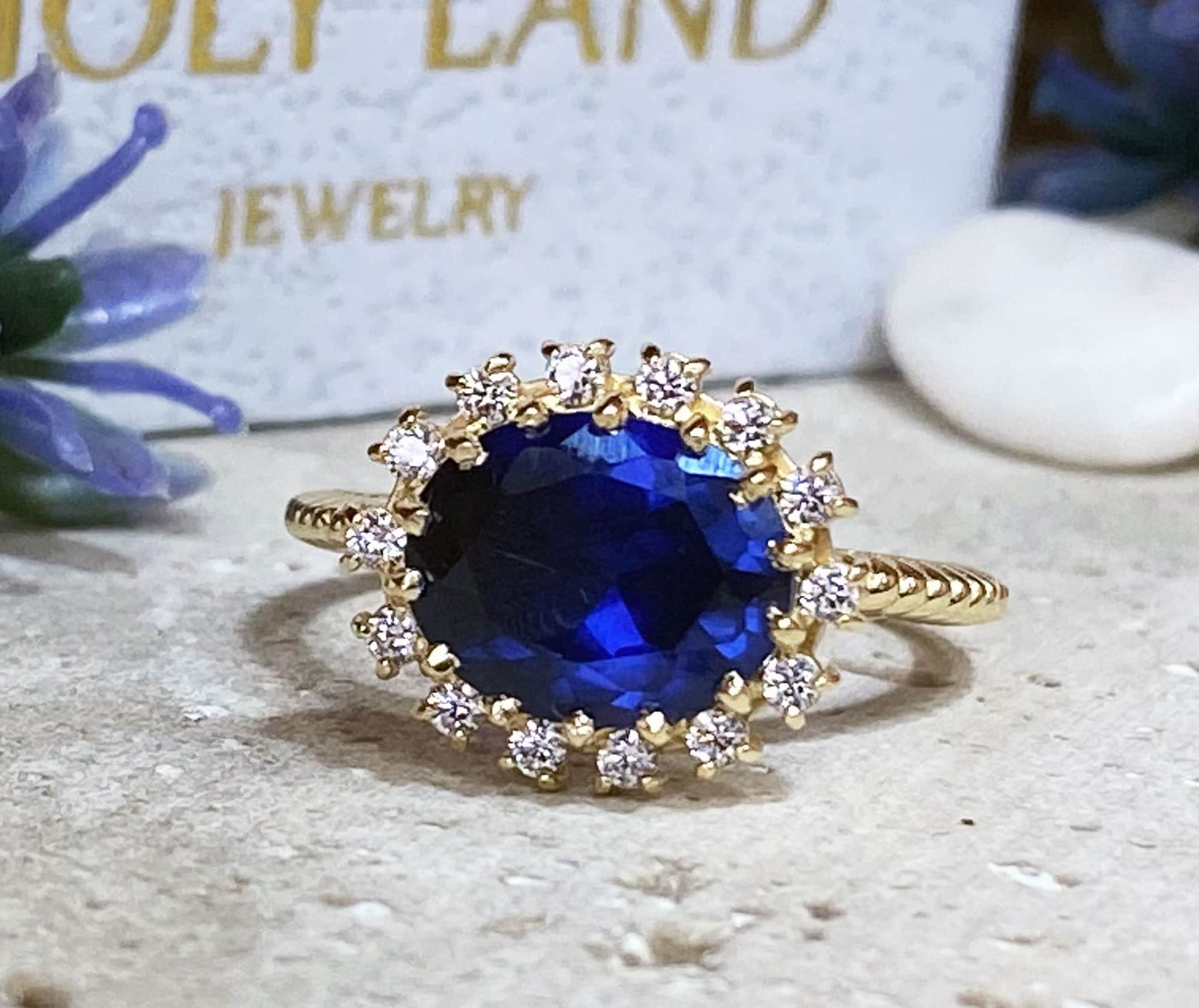 Blue Sapphire Ring - September Birthstone - Engagement Ring with Oval Blue Sapphire Gemstone and Clear Quartz Halo - H.L.Jewelry