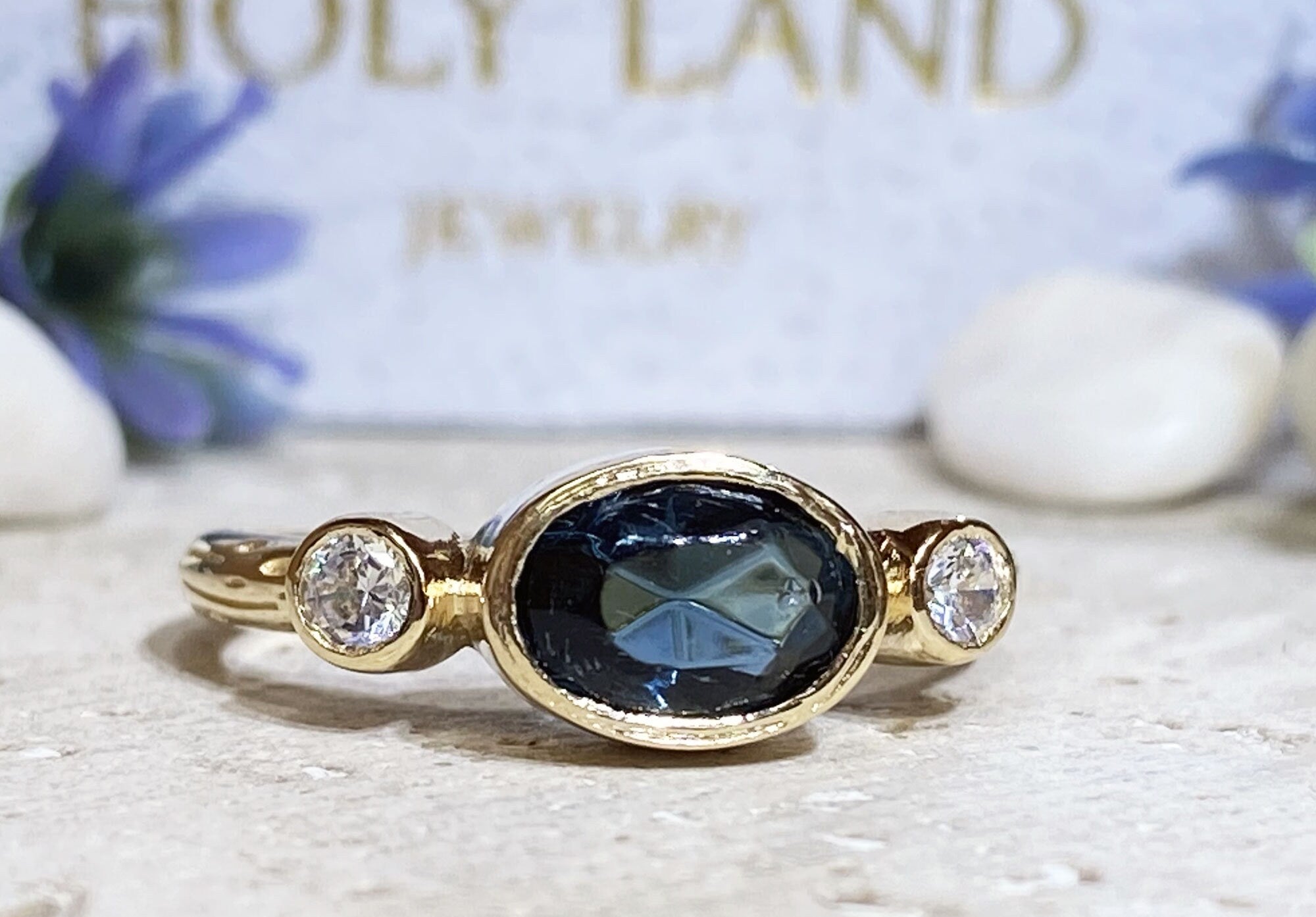 Blue Sapphire Ring - September Birthstone - Bezel Set Ring with Oval Blue Sapphire Gemstone and Clear Quartz Accents - H.L.Jewelry