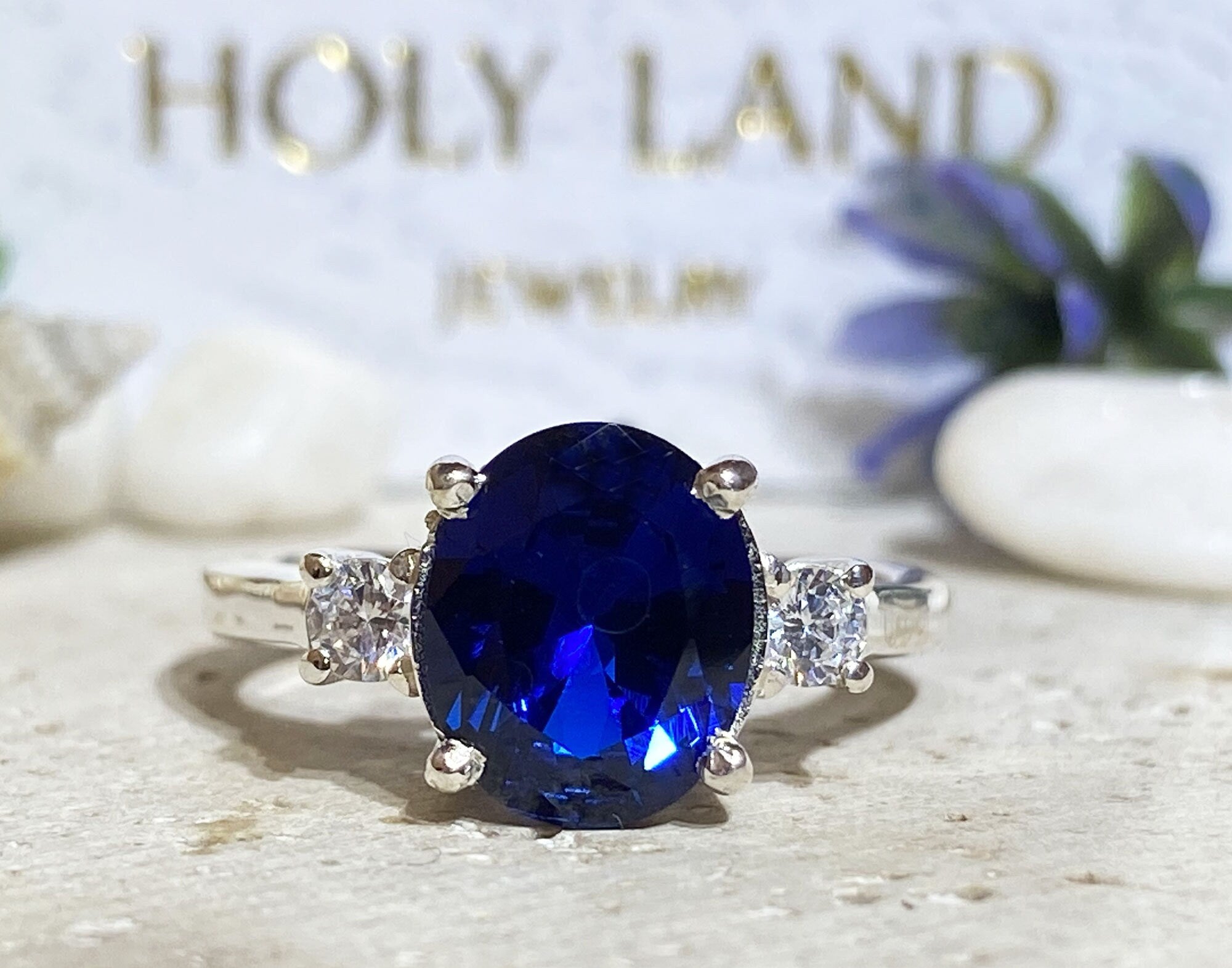 Blue Sapphire Ring - September Birthstone - Statement Engagement Ring with Oval Blue Sapphire Gemstone and Clear Quartz Accents - H.L.Jewelry