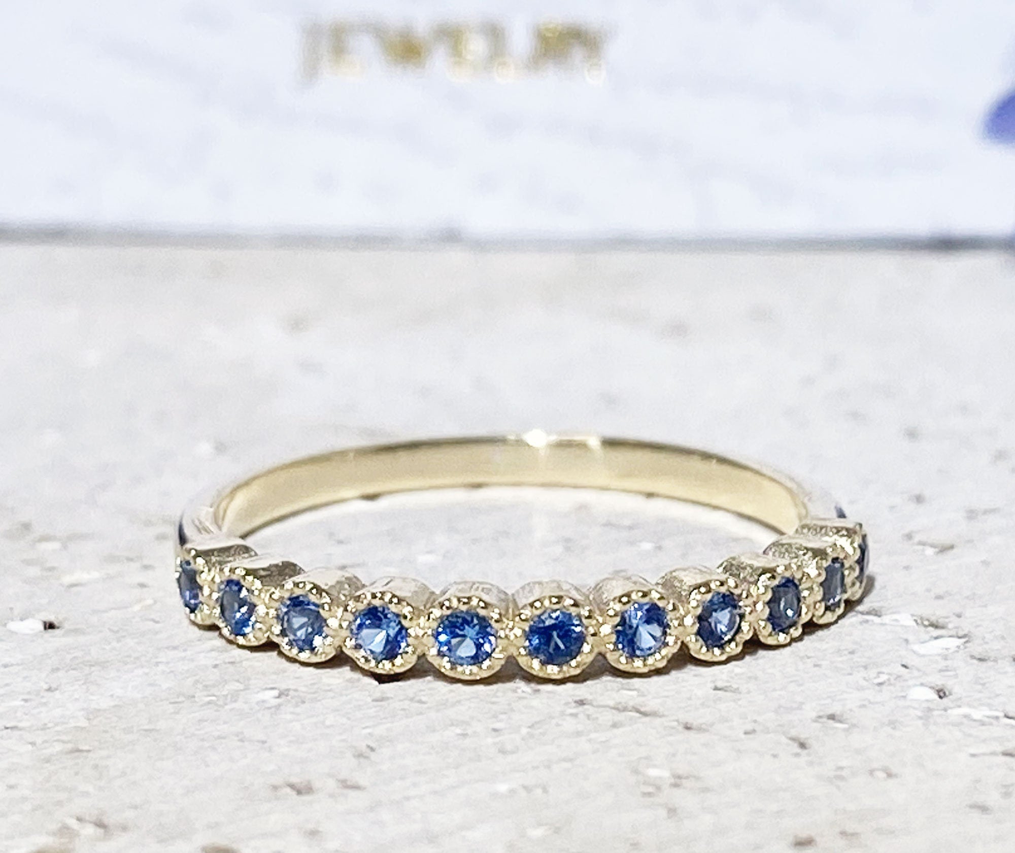 Blue Topaz Ring - December Birthstone - Delicate Stacking Half Eternity Ring with Eleven Round Blue Topaz Gemstones - H.L.Jewelry