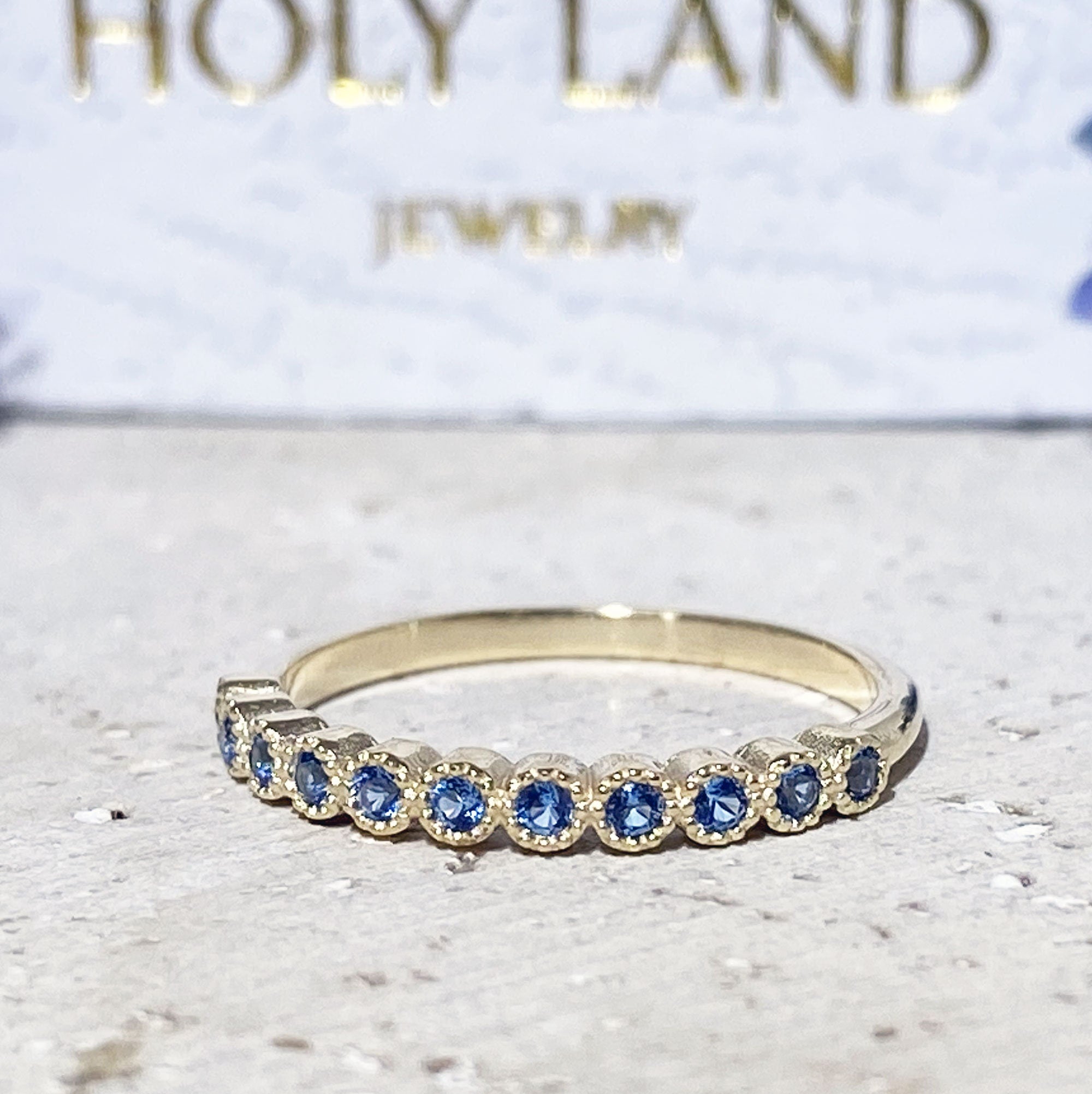 Blue Topaz Ring - December Birthstone - Delicate Stacking Half Eternity Ring with Eleven Round Blue Topaz Gemstones - H.L.Jewelry