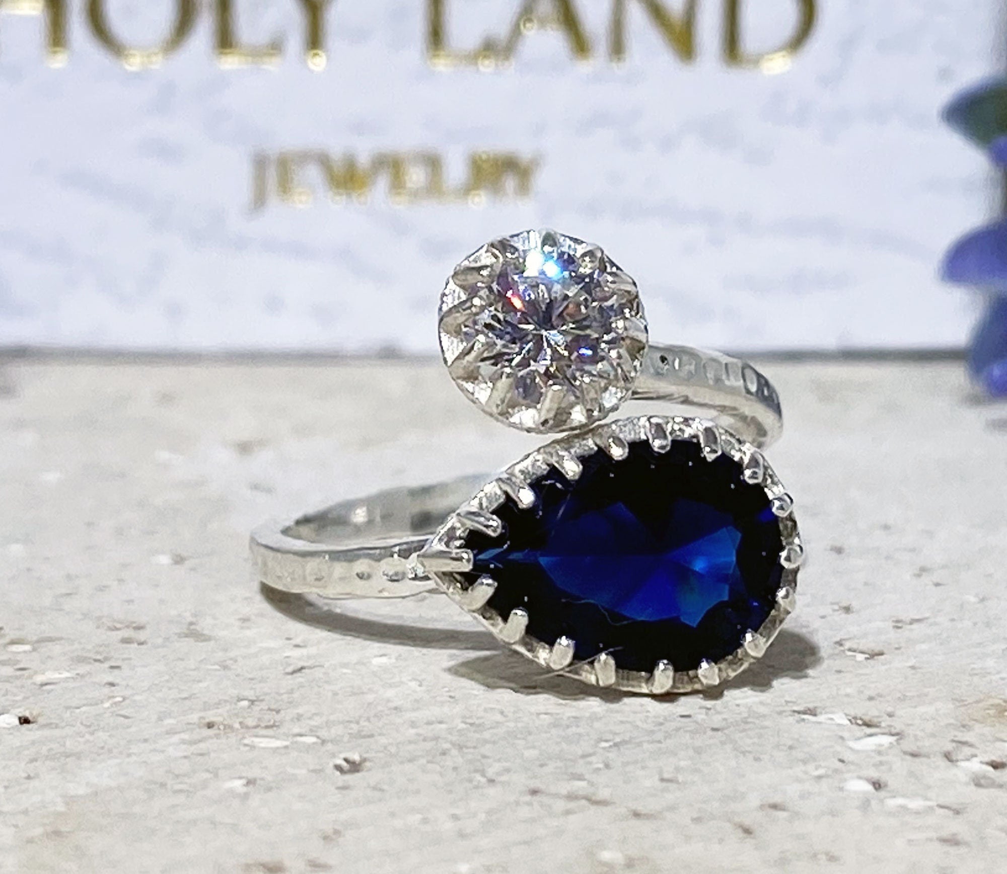 Dual Gemstone Ring - Two Birthstone Ring - Hammered Band Ring with Pear-Shaped Blue Sapphire Gemstone and Round Clear Quartz - H.L.Jewelry