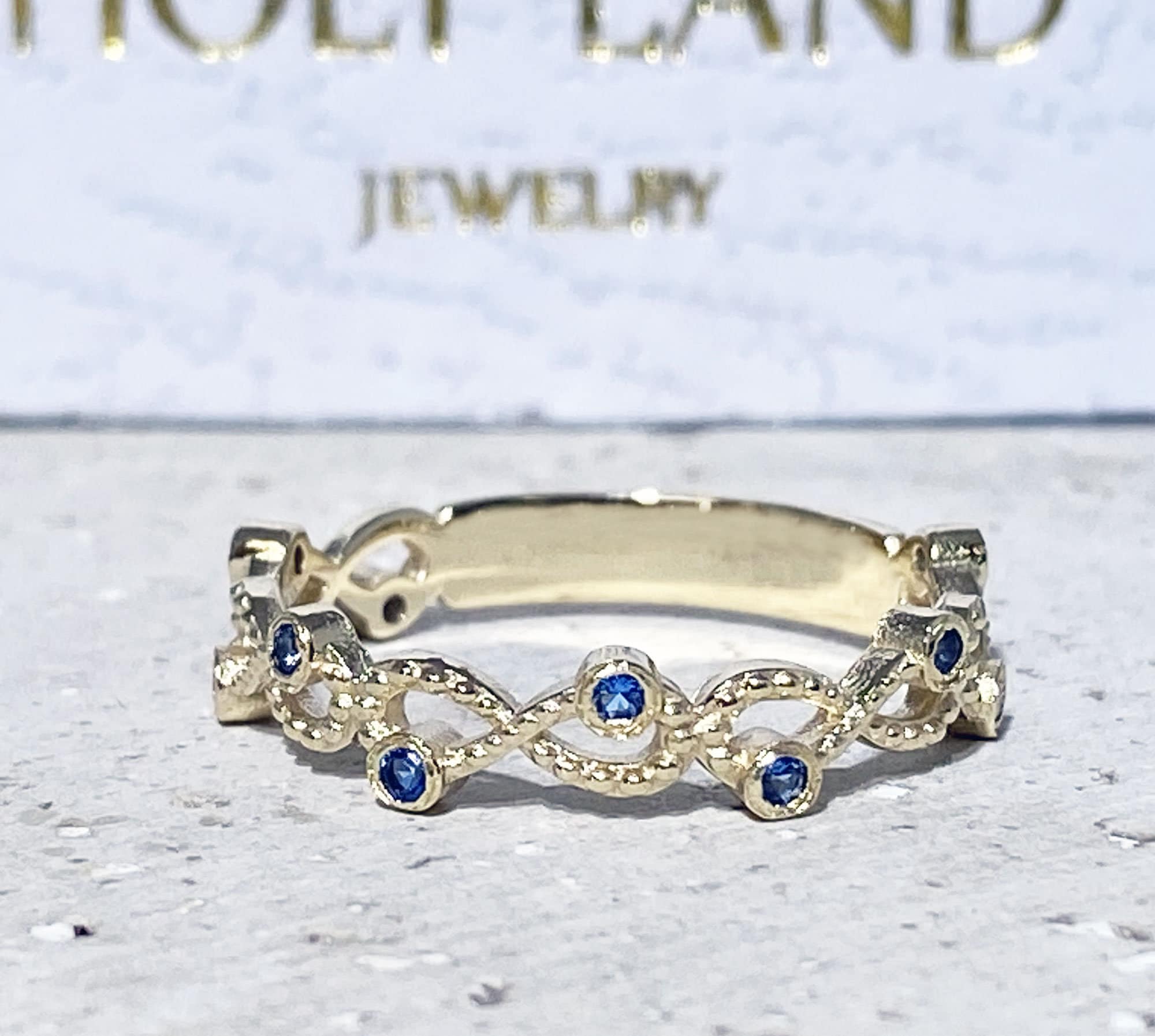 Blue Topaz Ring - December Birthstone - Infinity Ring with Small Round Blue Topaz Gemstones - H.L.Jewelry