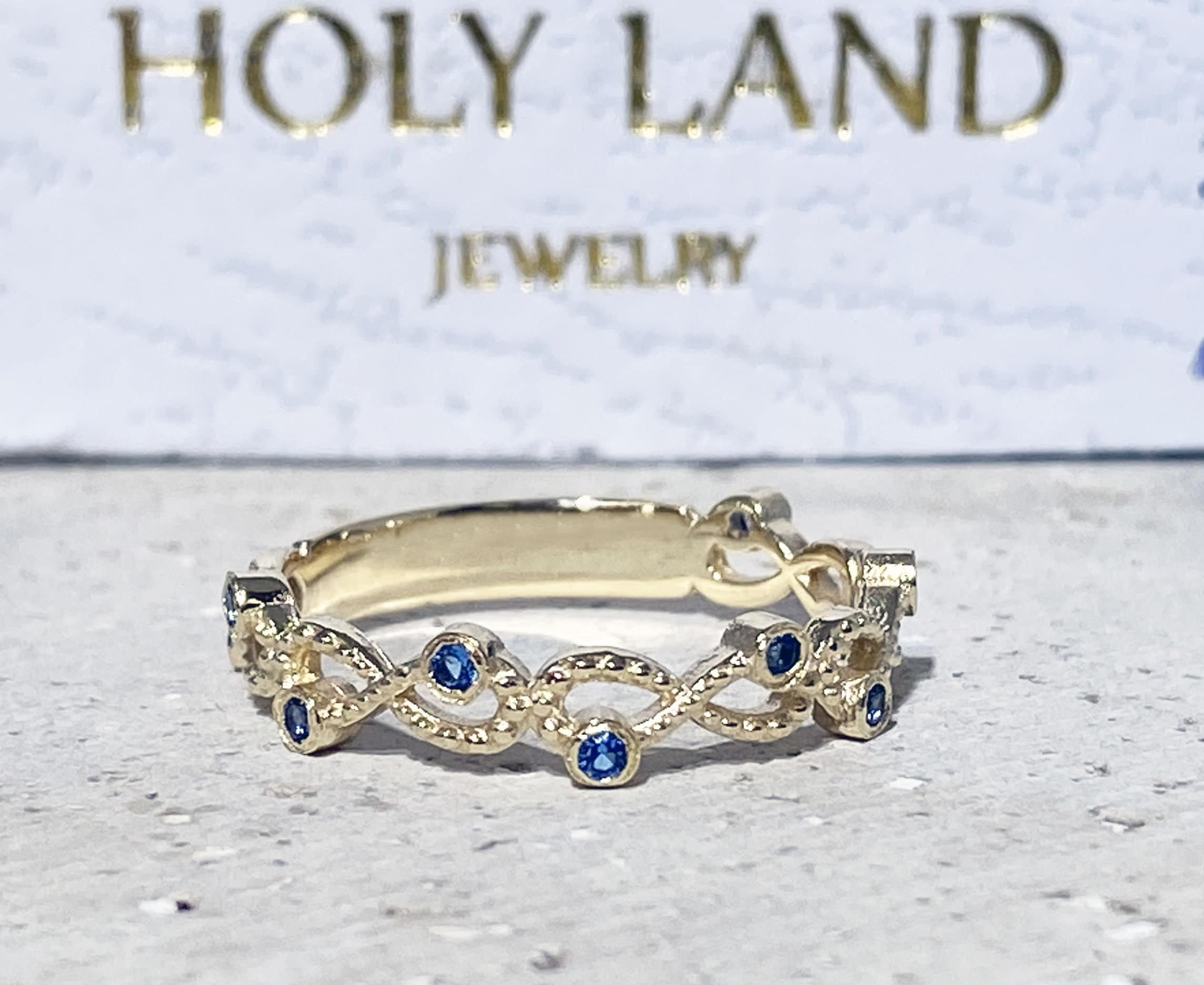 Blue Topaz Ring - December Birthstone - Infinity Ring with Small Round Blue Topaz Gemstones - H.L.Jewelry